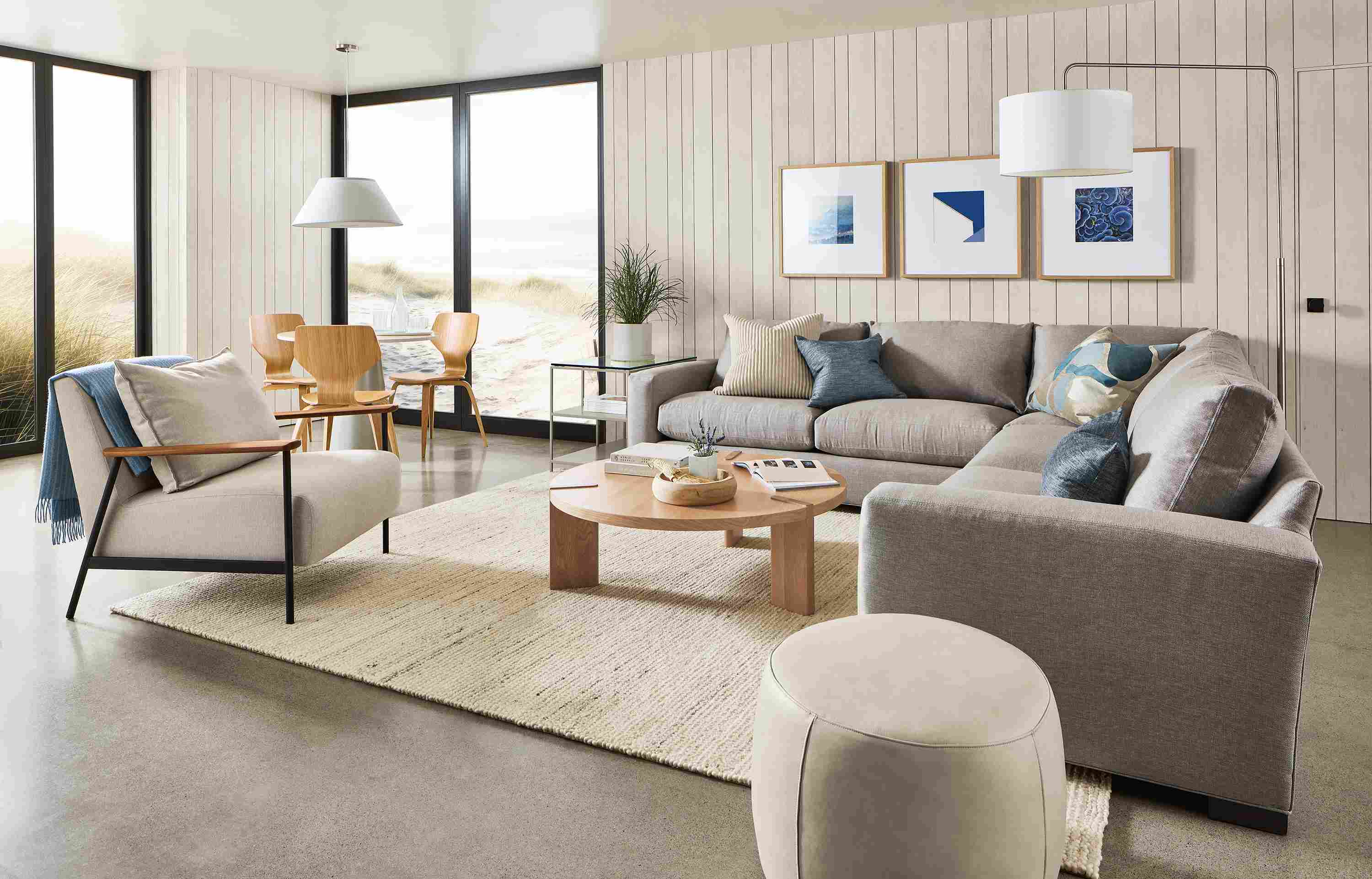 living room with metro sectional, xavier chair, three profile frames.