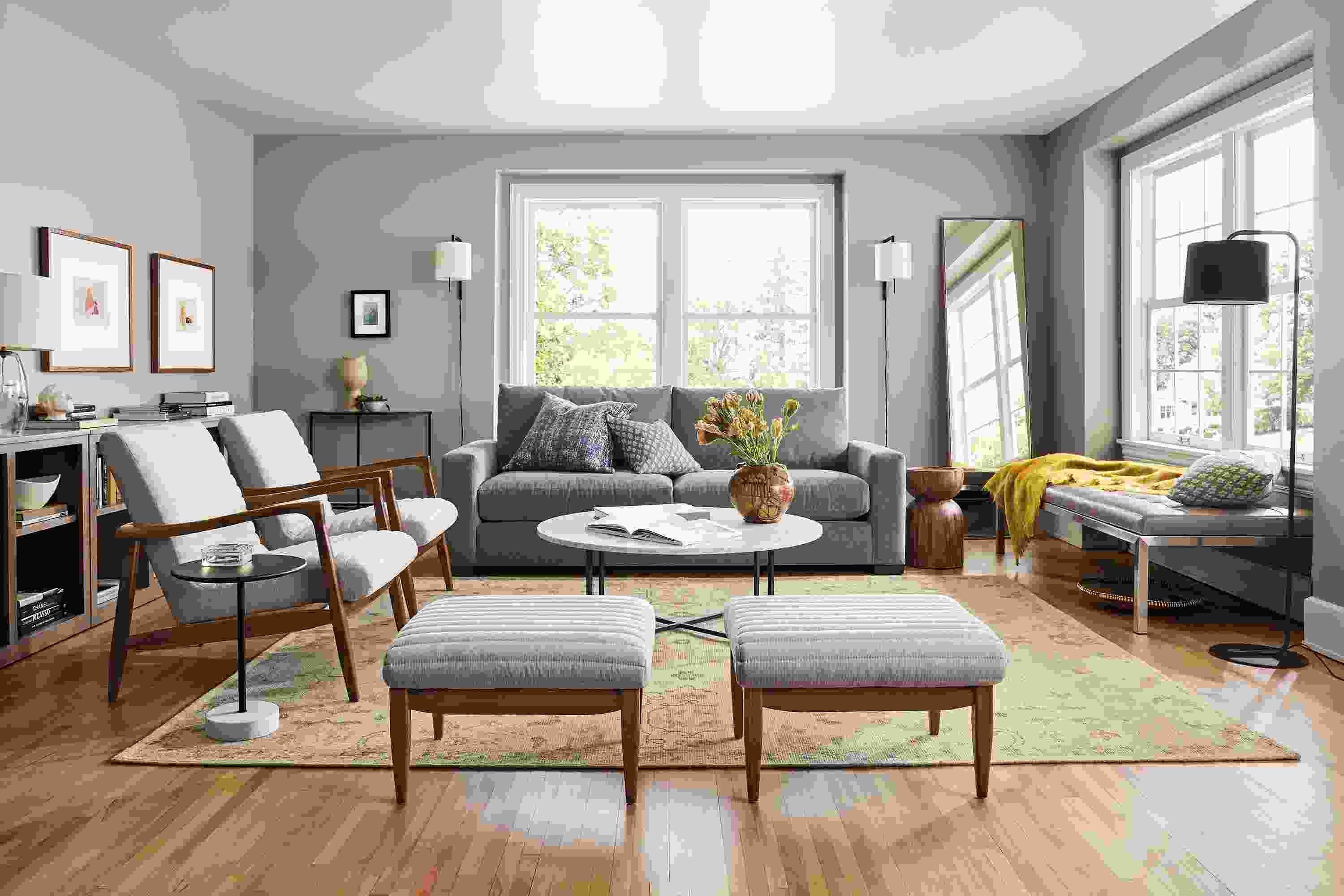 Living room with Metro sofa in Vick Lead, 2 Callan chairs and ottomans in Flint Oatmeal and ravella daybed.