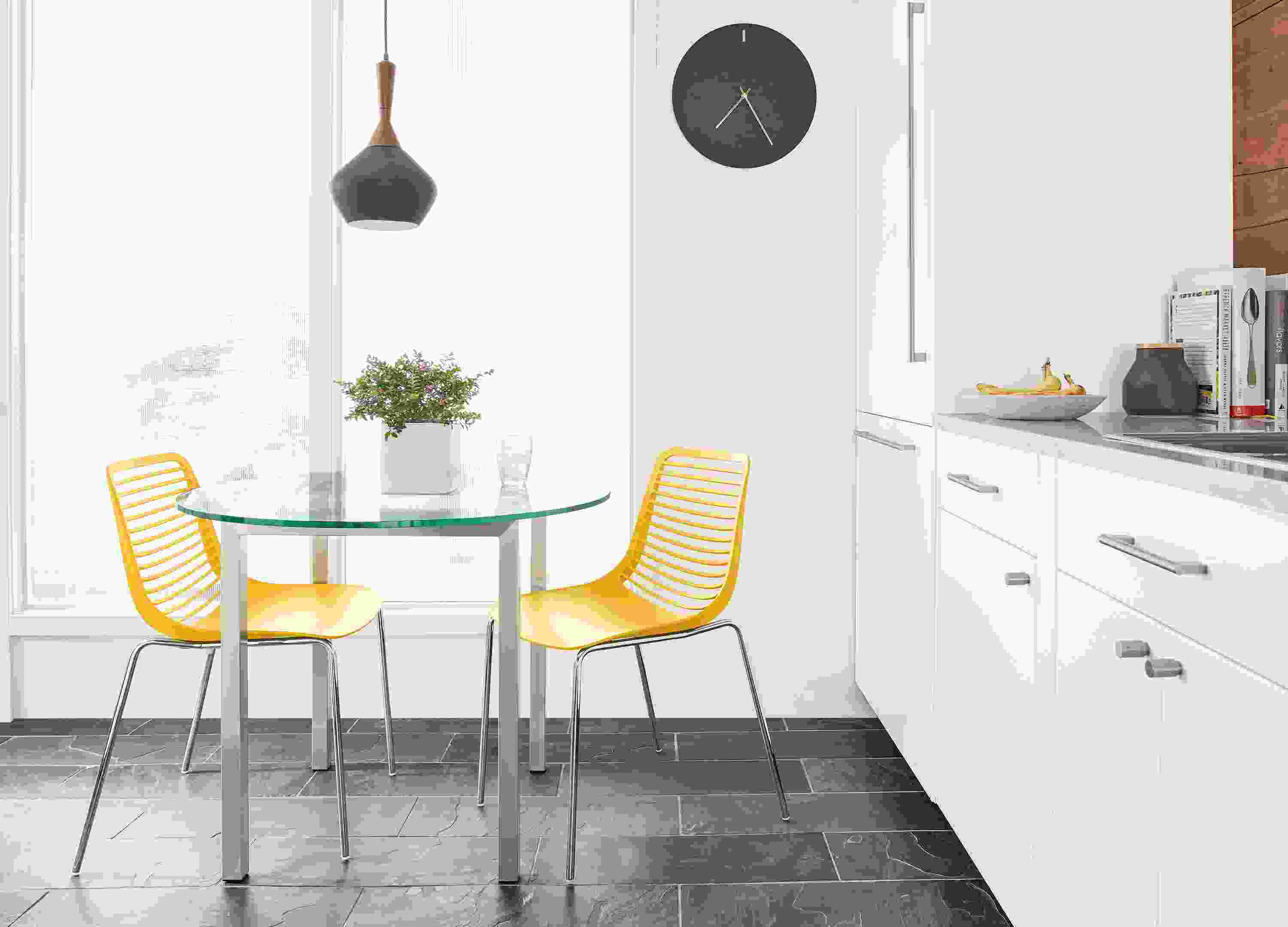 Detail of yellow Mini kitchen chairs.