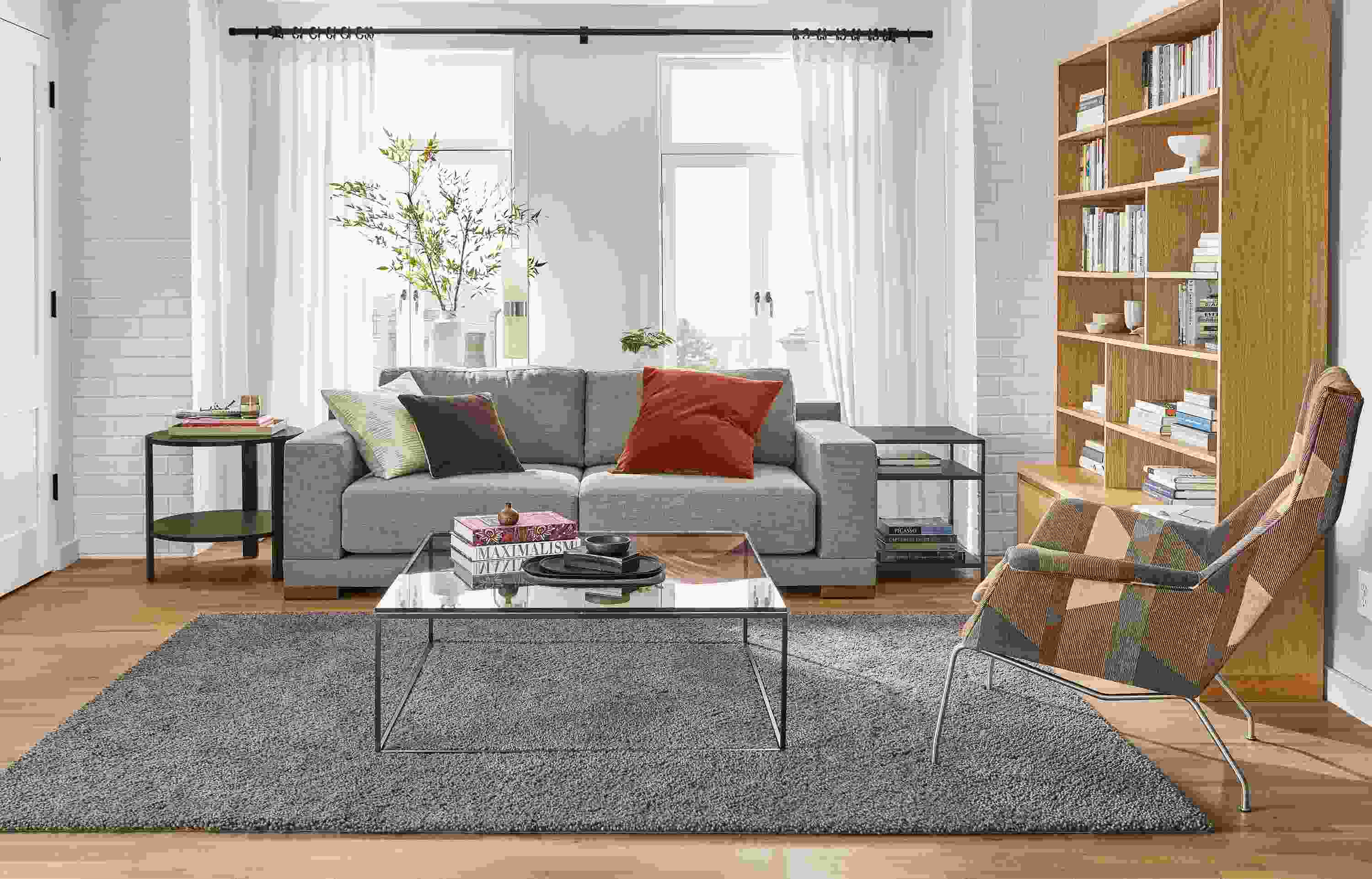 Detail of Mira sofa in Destin Putty fabric in small living room.