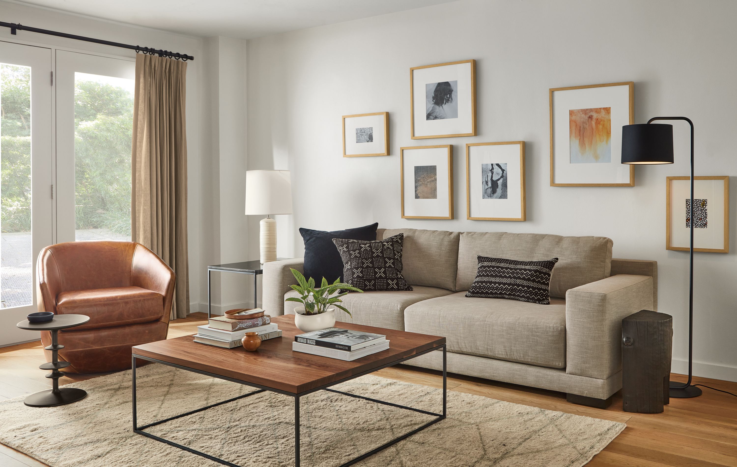 Mira 96-wide sofa in Destin Fabric, Tyne 40-square coffee table in Walnut and Natural Steel and Veda rug in Camel.