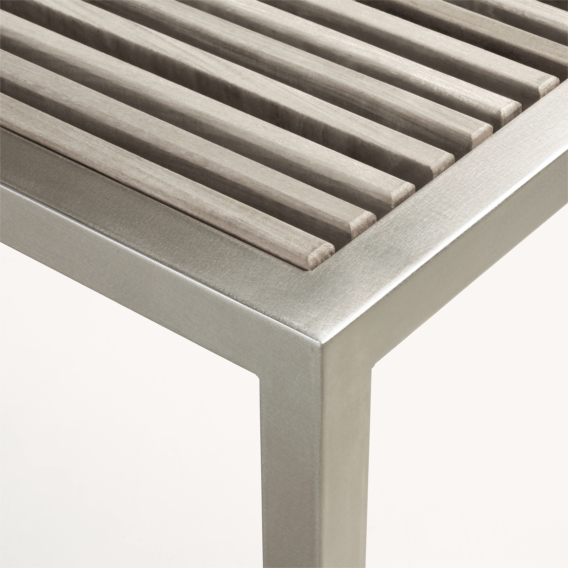 corner detail of Montego 54-wide Bench in aged Reclaimed Ash and stainless steel frame.