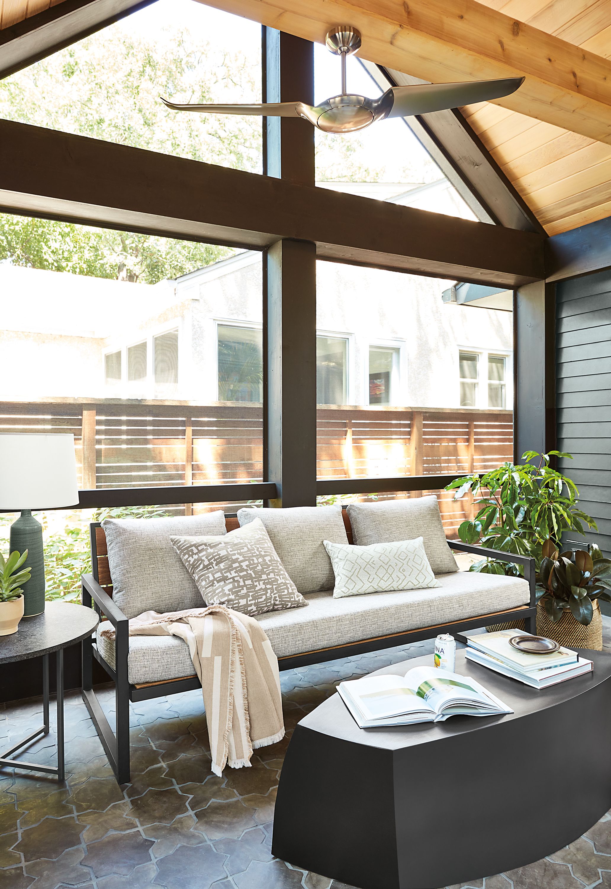 Sunroom setting with Montego 80-wide Sofa with Cushions in Phipps Fabric and Gehry 50-wide Bench in Black.
