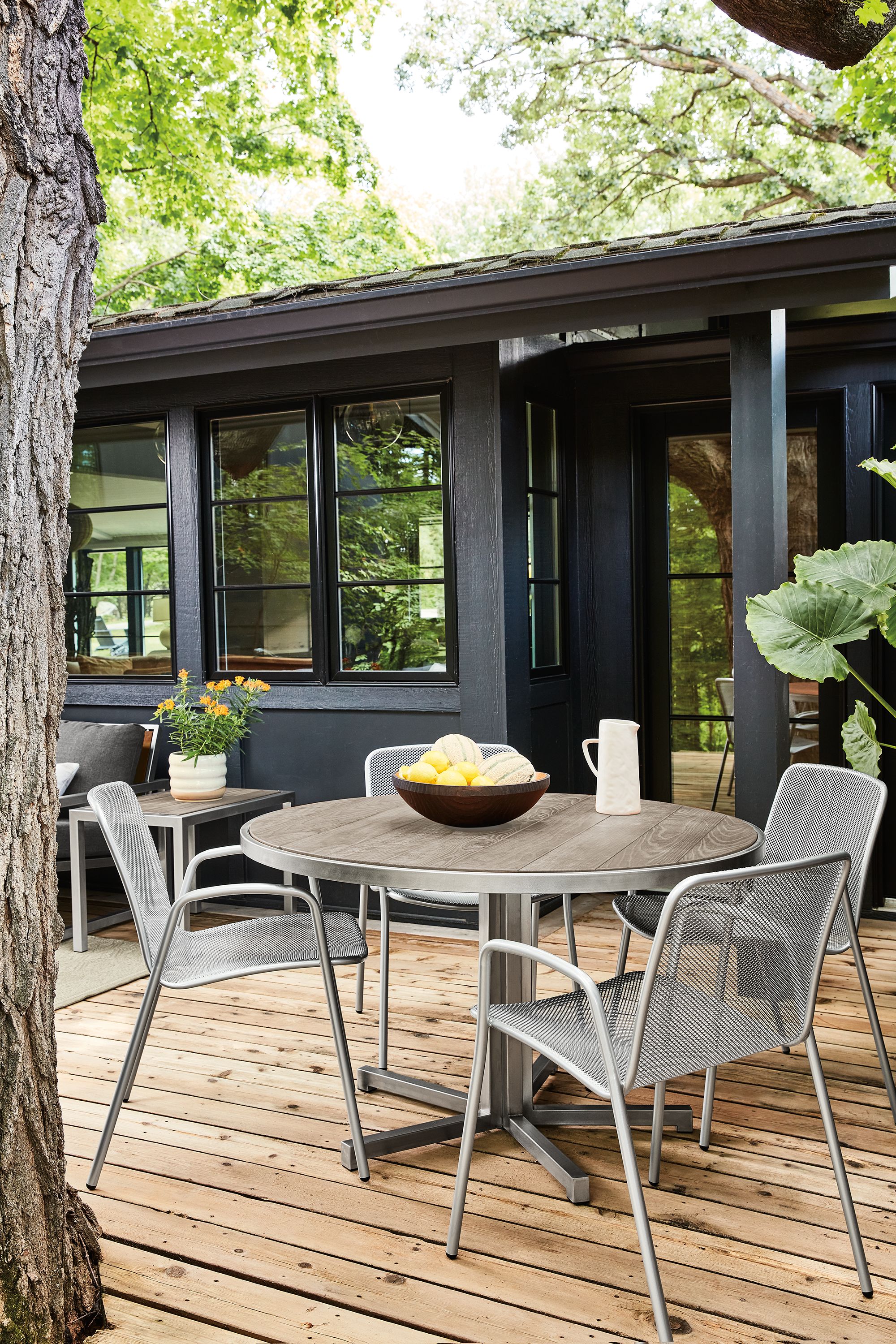 48 diam table with stainless steel frame. Over about one year, the wood will age to the silver-grey color shown.
