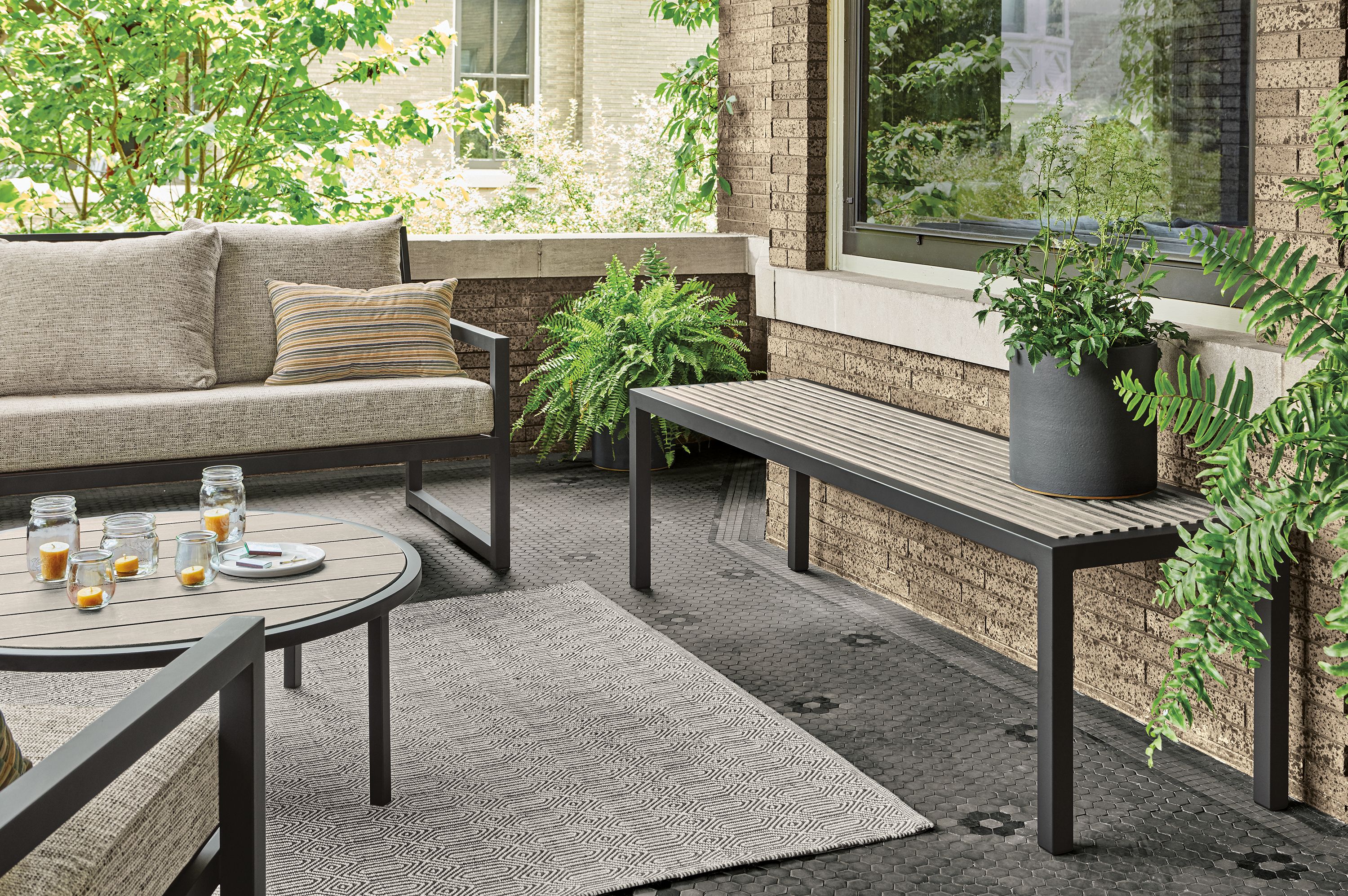 outdoor patio with montego table  in aged ash with white base and 6 bellini chairs in white.