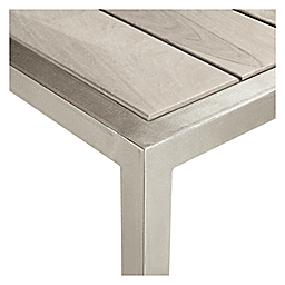 corner detail of Montego 60-wide Table in aged Reclaimed Ash and stainless steel frame.