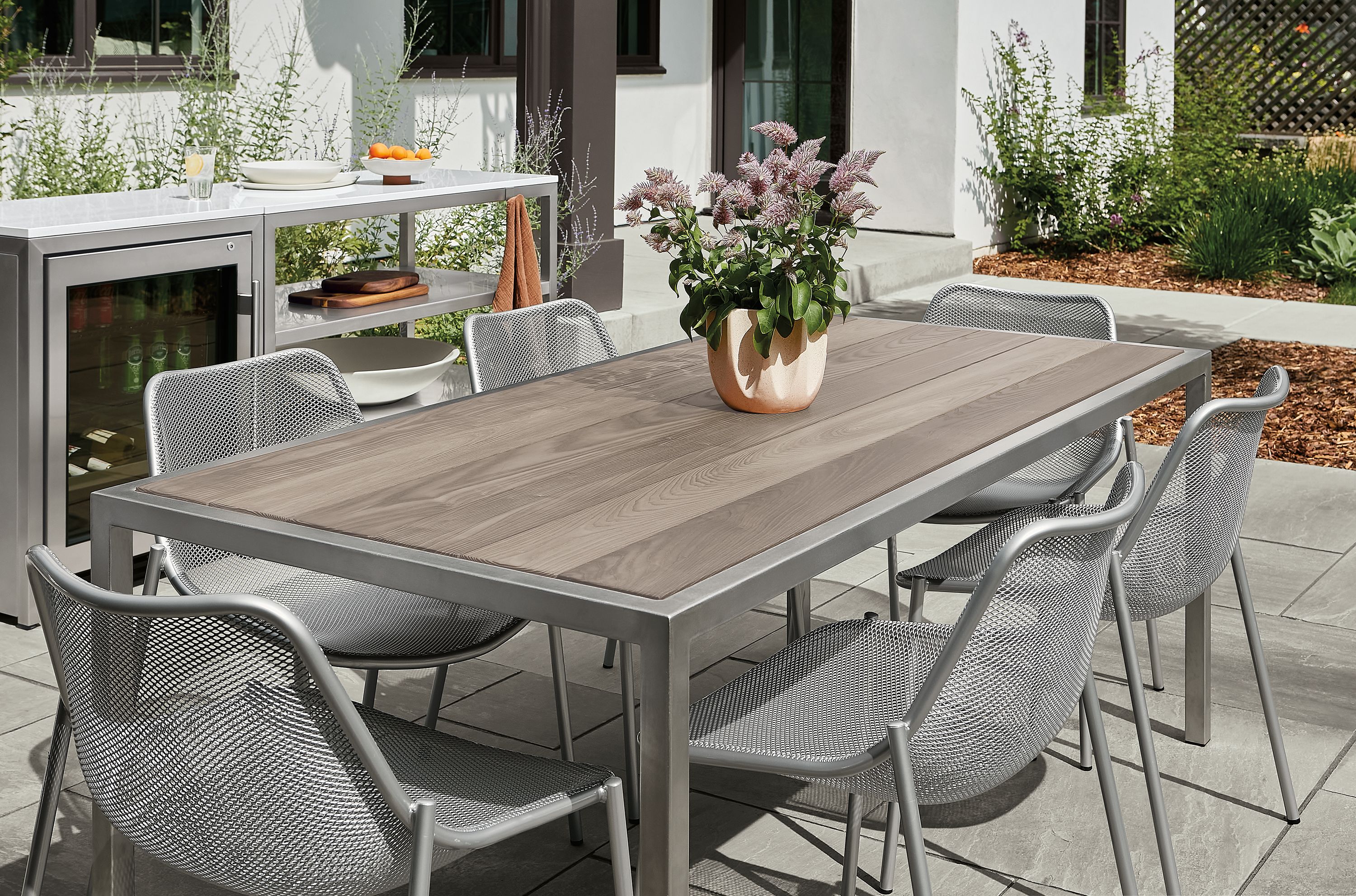 72w table with stainless steel frame. Over time, the wood will age to the silver-grey color shown.