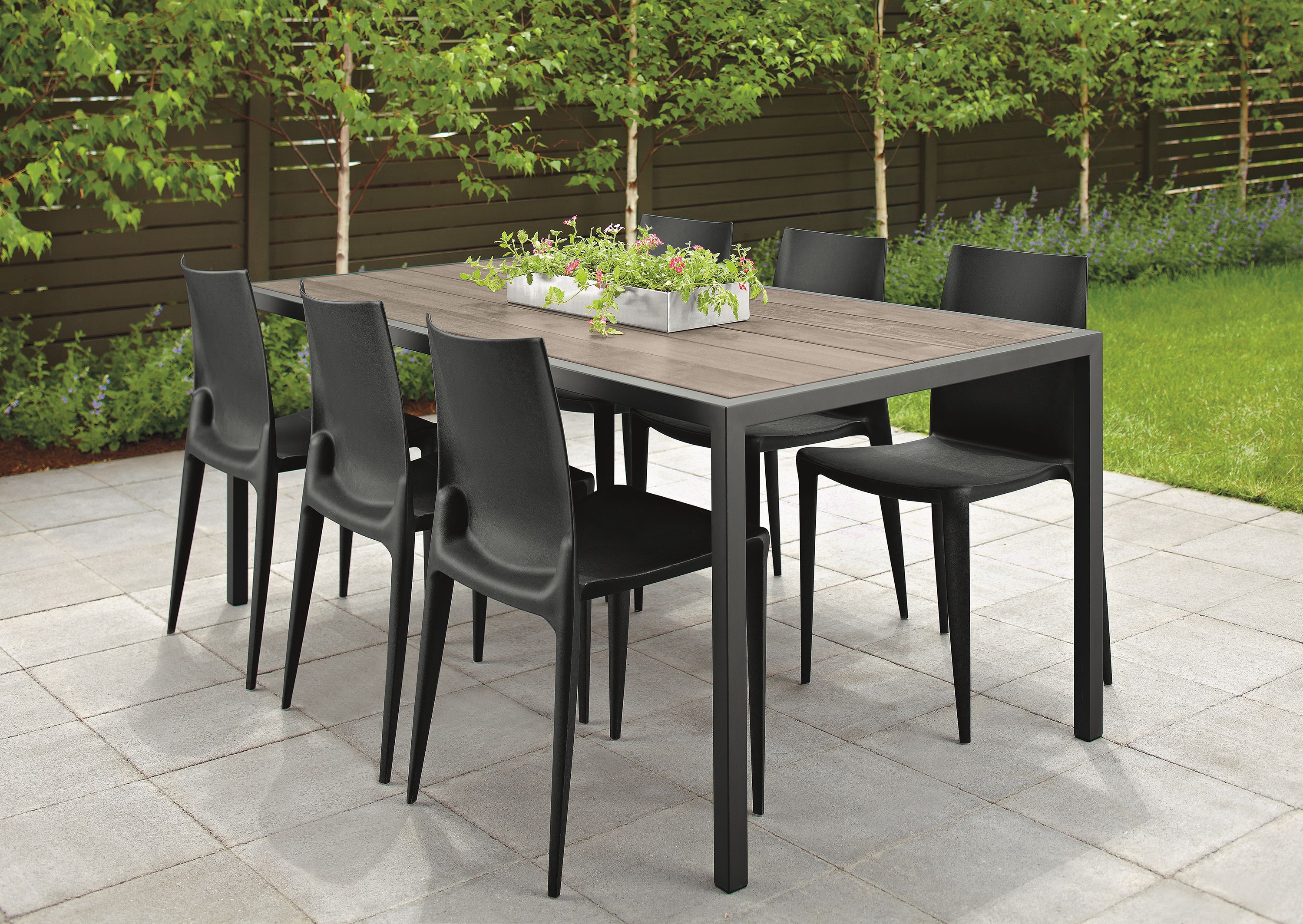 Patio with Montego 72-wide table in graphite and aged reclaimed oak and graphite and 6 Bellini chairs in black.