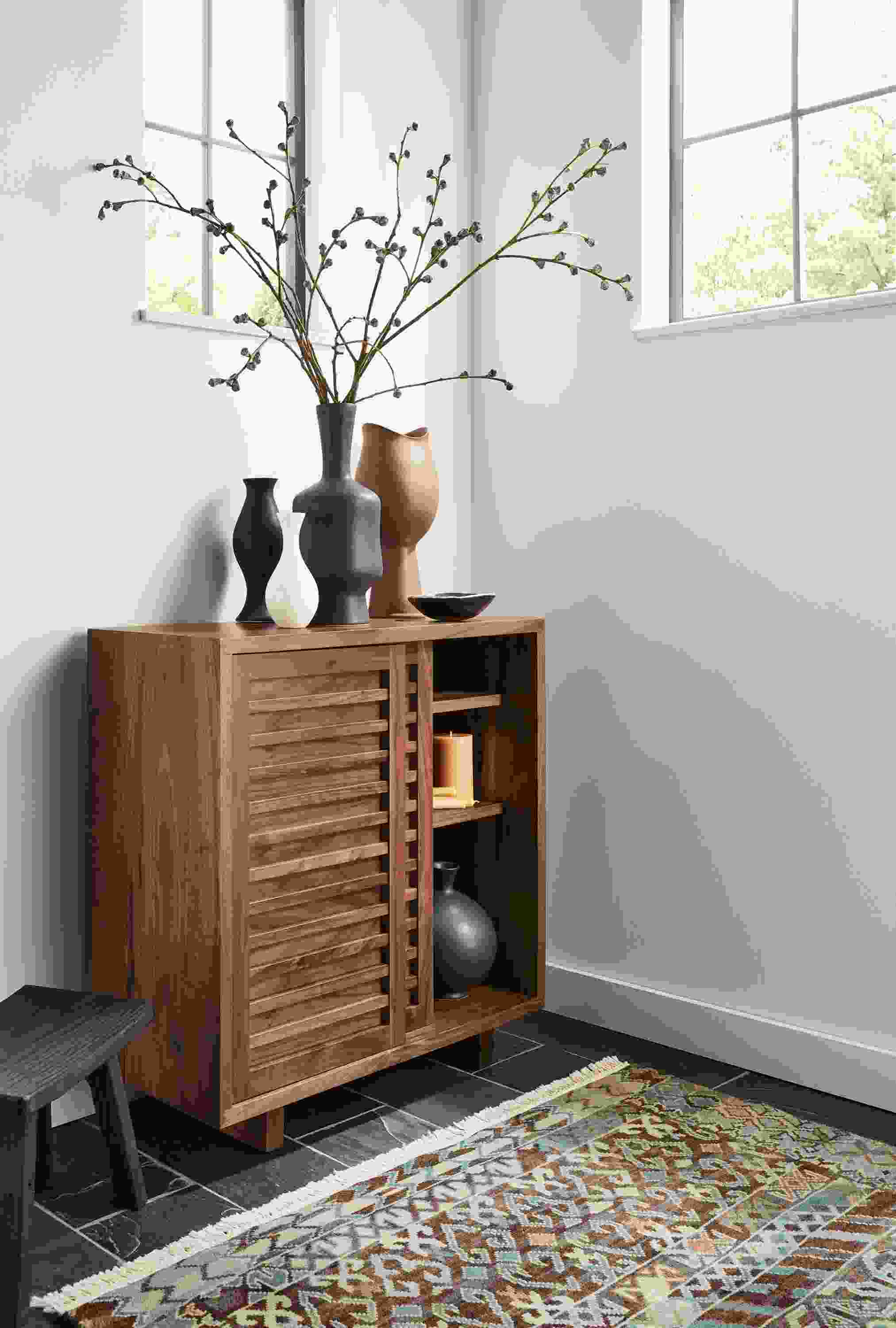 Room setting with a Moro 30-wide storage cabinet in Walnut and a Timuri rug.