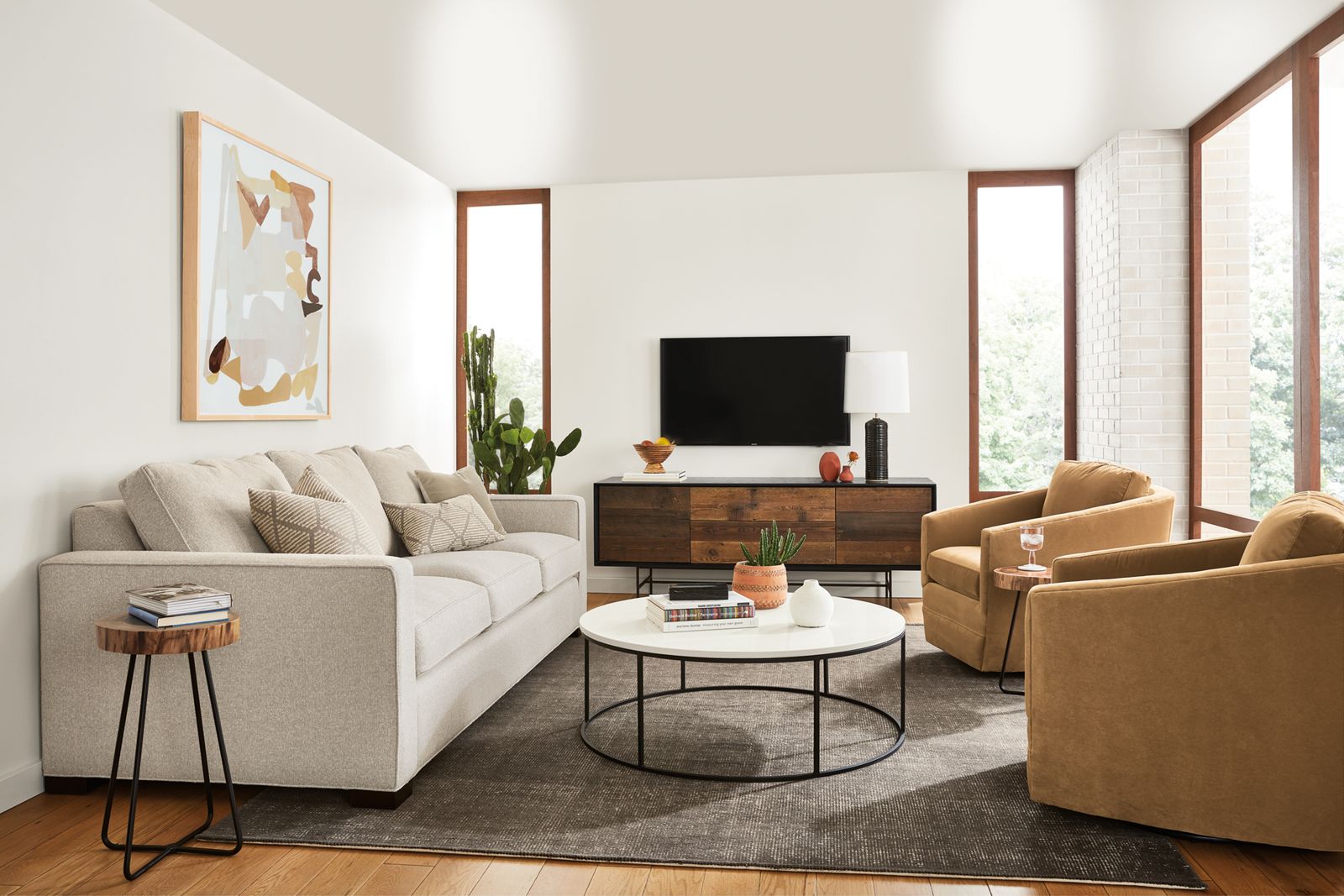 room setting with morrison sofa, samar rug, tyne coffee table and 2 ford swivel chairs.