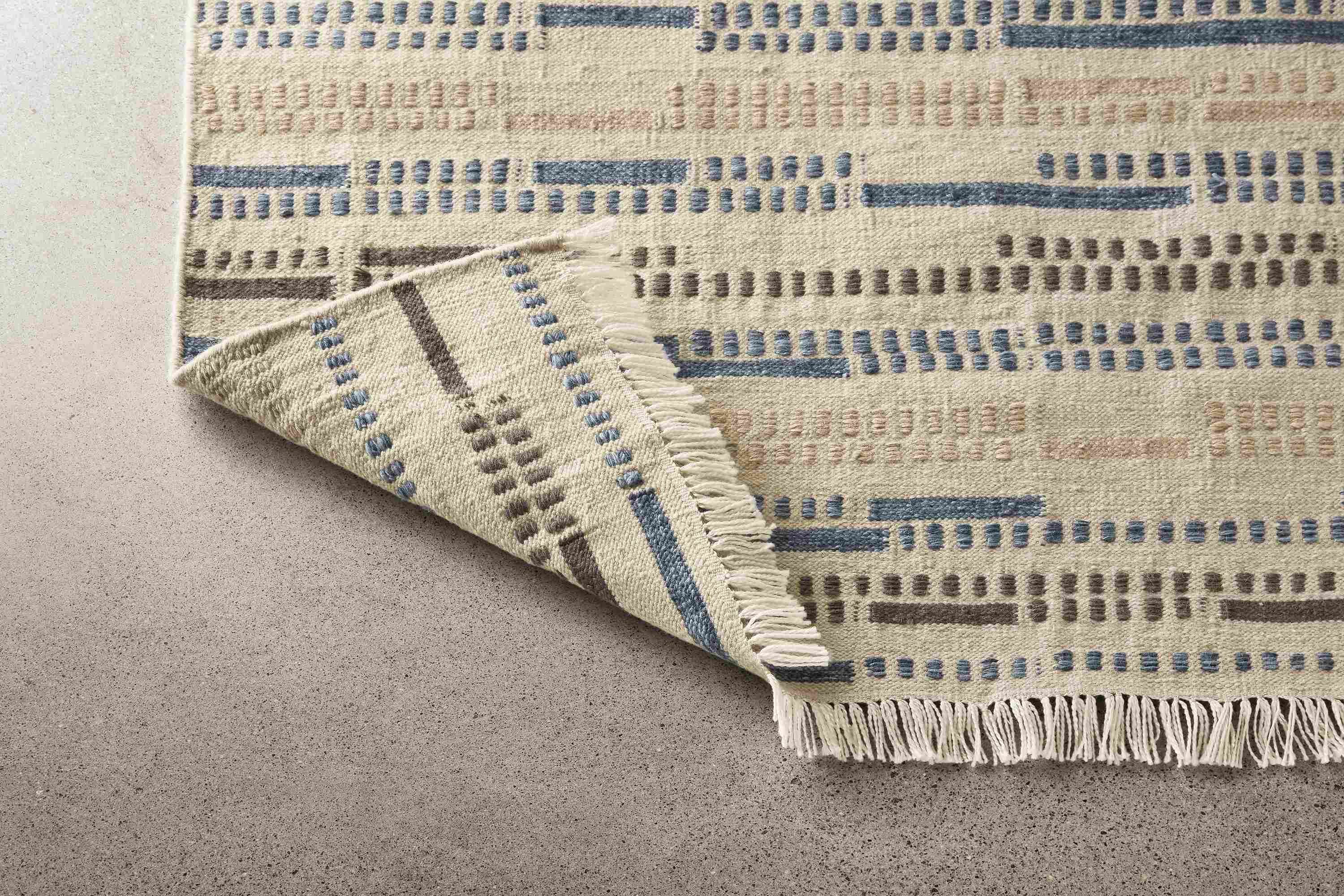 Close detail of Morse rug.
