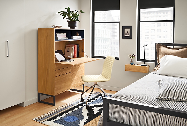 Room setting with a Mosby 40 Office Armoire and Cato Office Chair in Synthetic Leather.