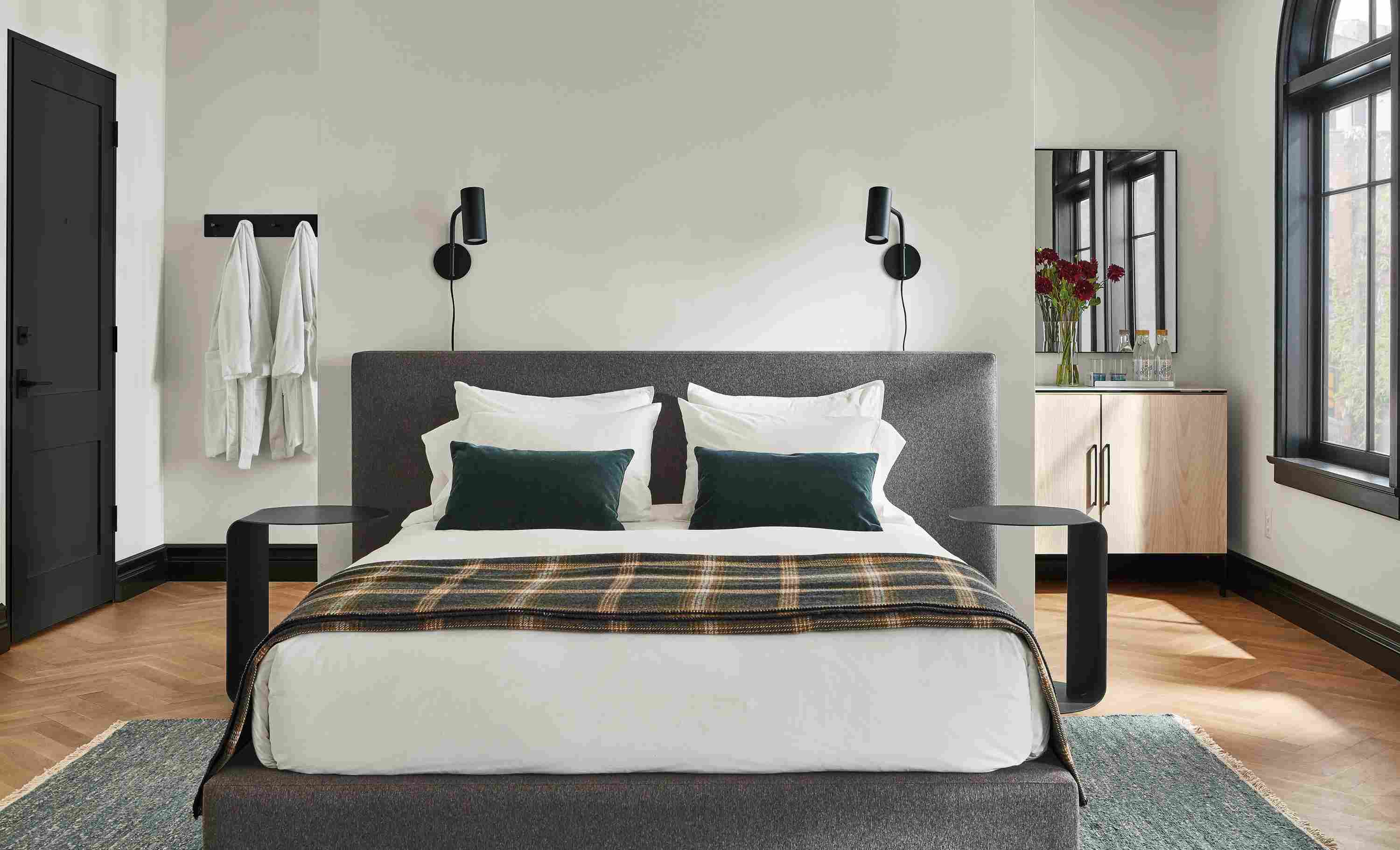 Bedroom setting with a Munro Queen Bed in Flint Fabric and two Eileen Gray Round End Tables on a Hastings Rug.