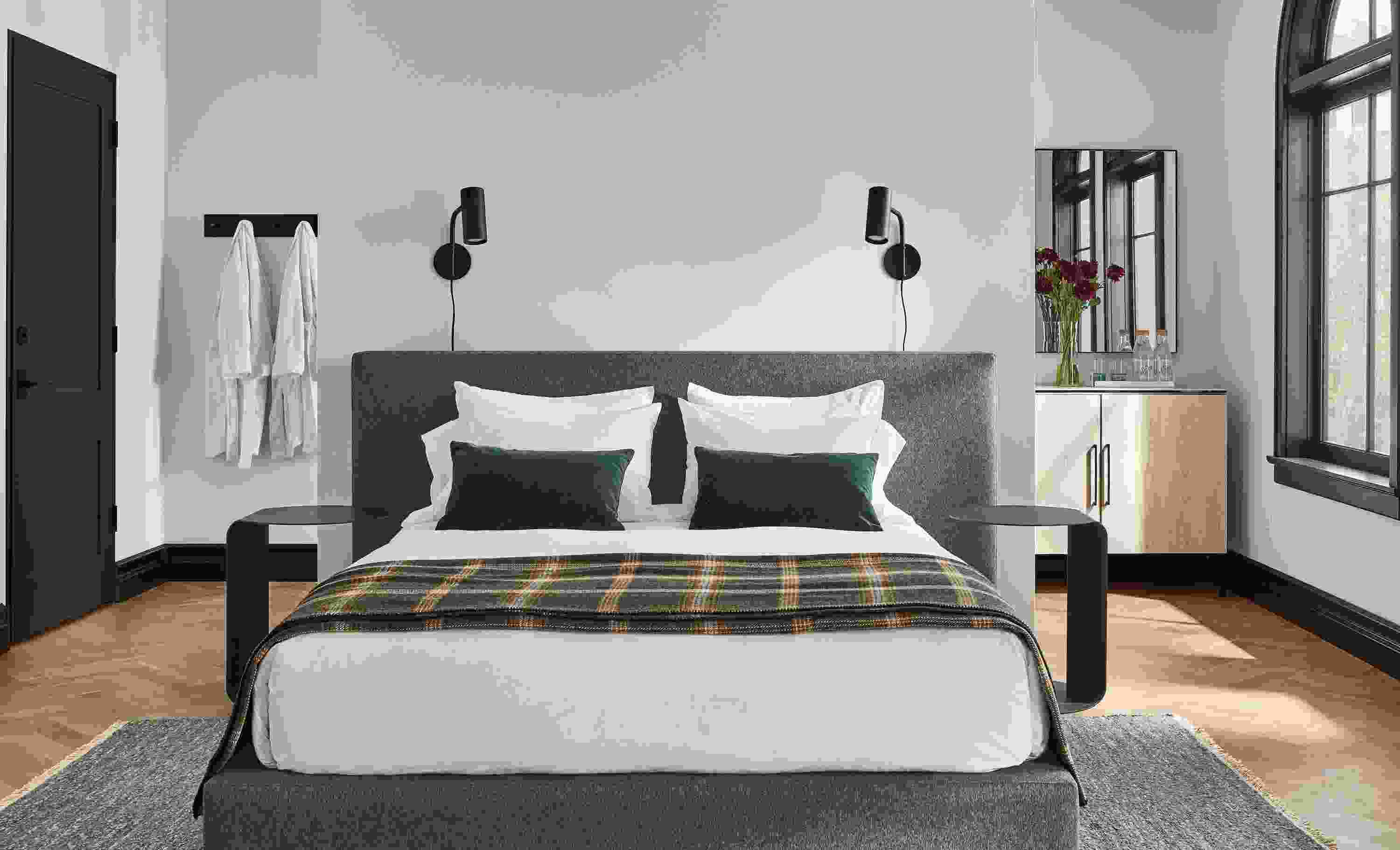 Bedroom setting with a Munro Queen Bed in Flint Fabric and two Eileen Gray Round End Tables on a Hastings Rug.