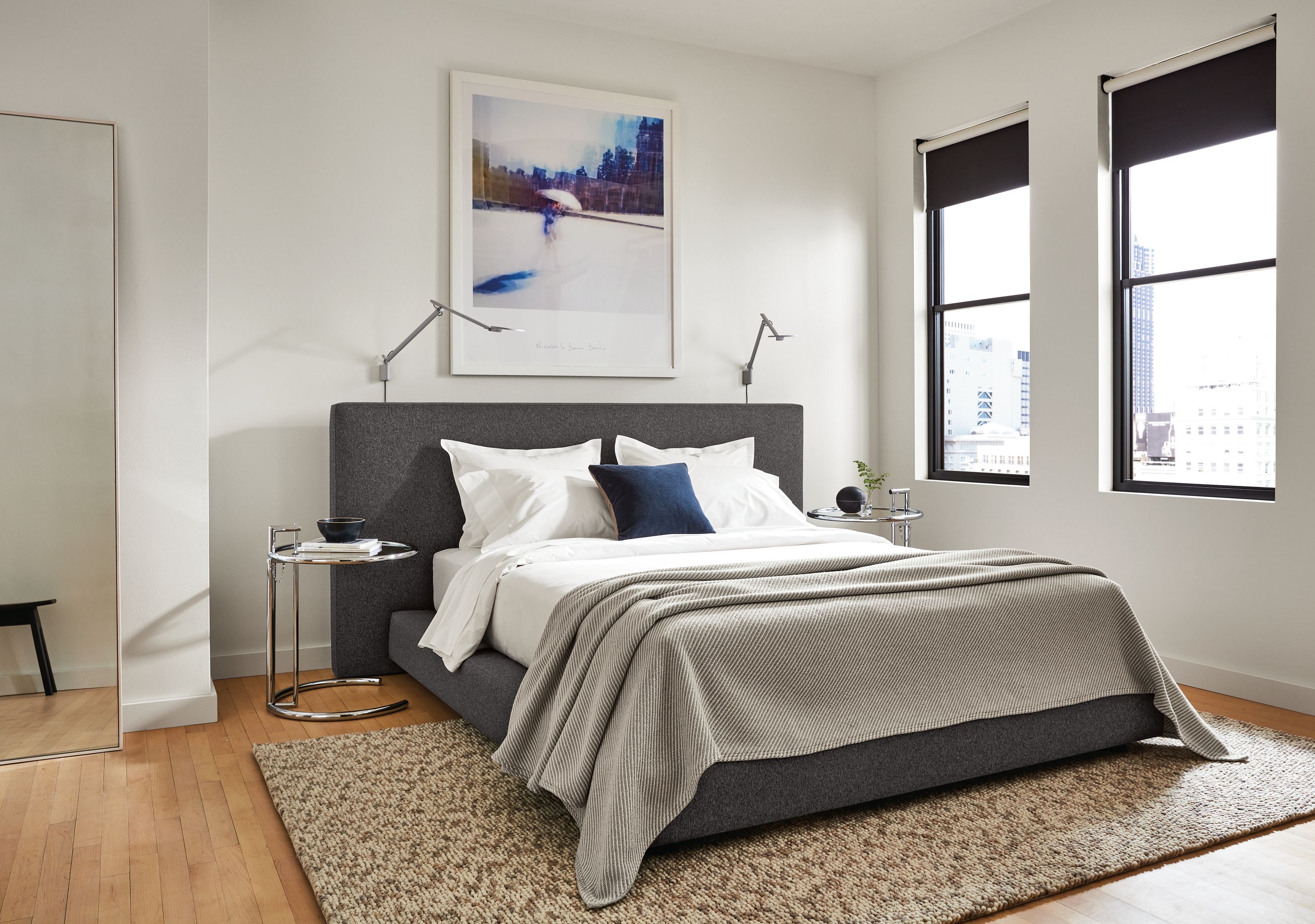 Bedroom setting with a Munro Queen Bed in Flint Fabric and two Eileen Gray Round End Tables on a Hastings Rug.