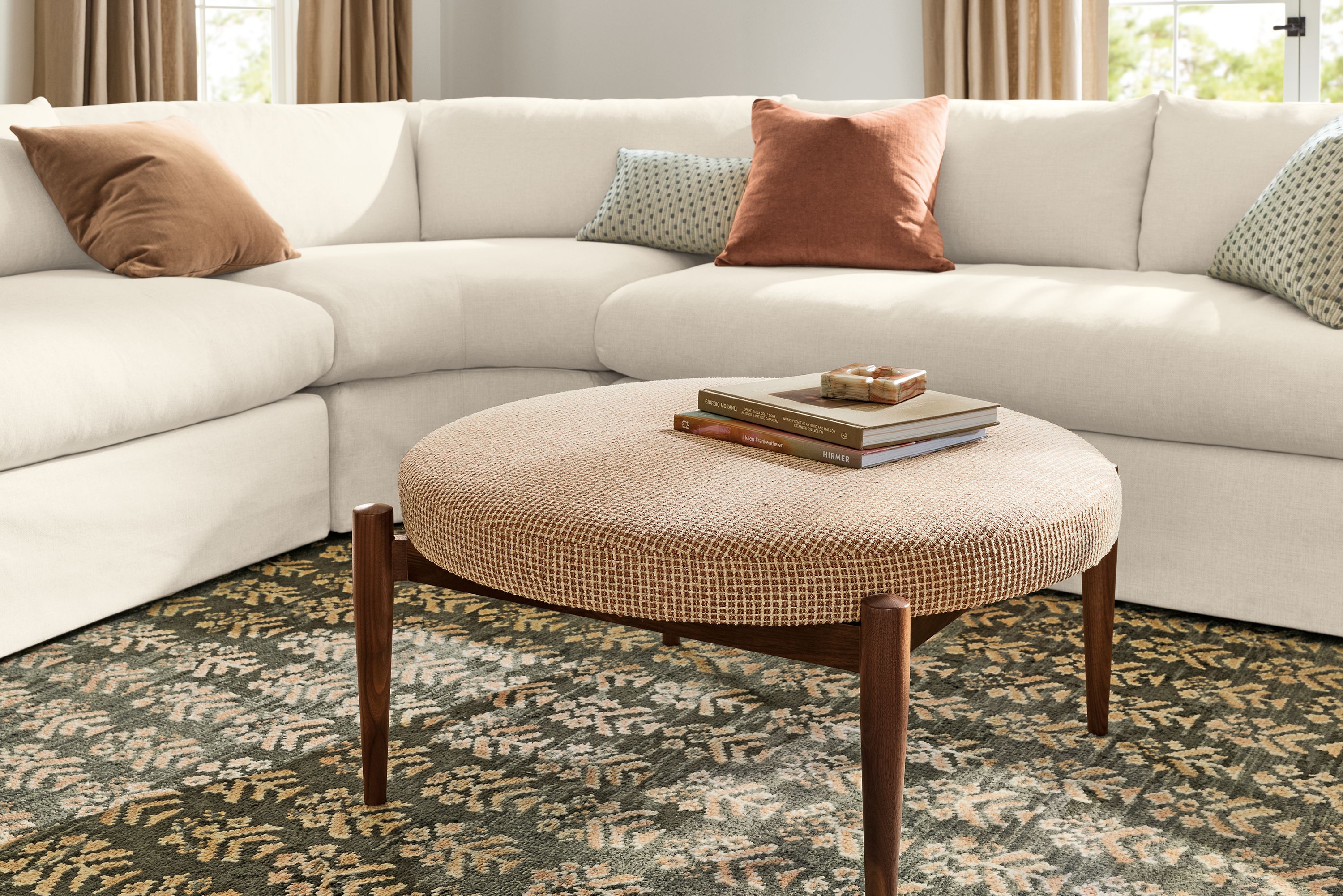 41" diam round ottoman in Dorsa clay fabric and walnut legs