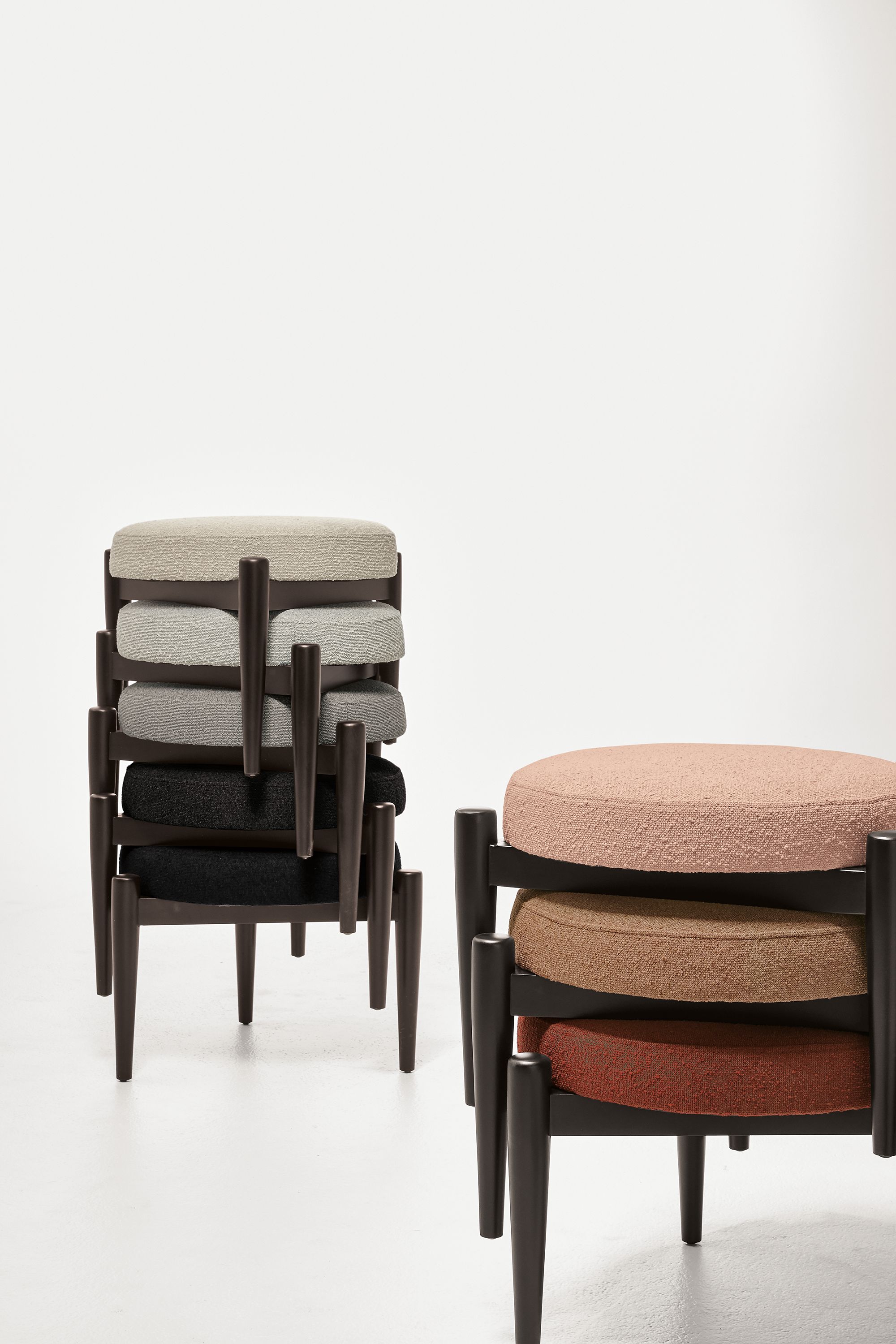 Detail of 8 stacked Murphy ottomans in declan fabrics.
