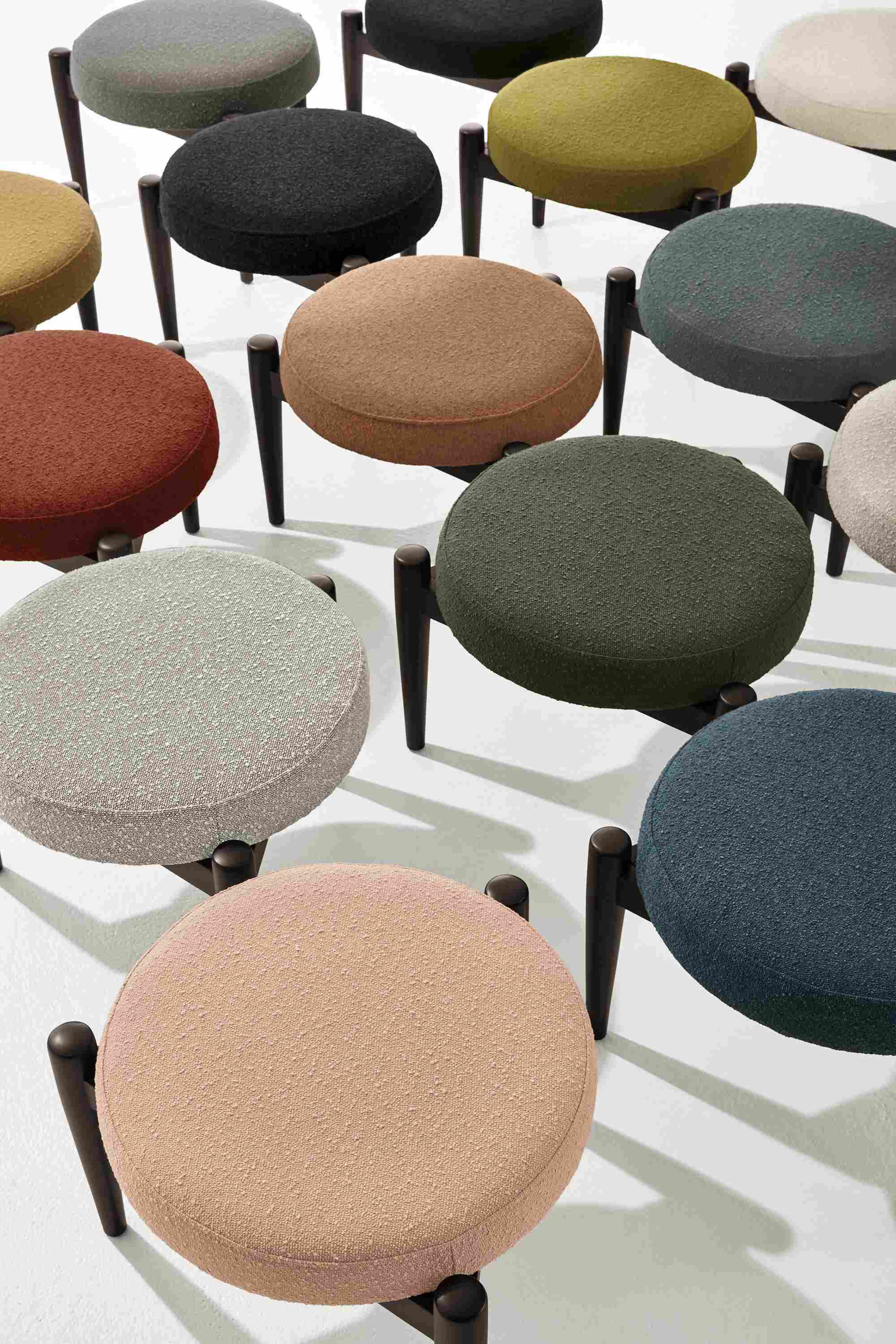 Detail of rows of Murphy ottomans in declan fabrics.