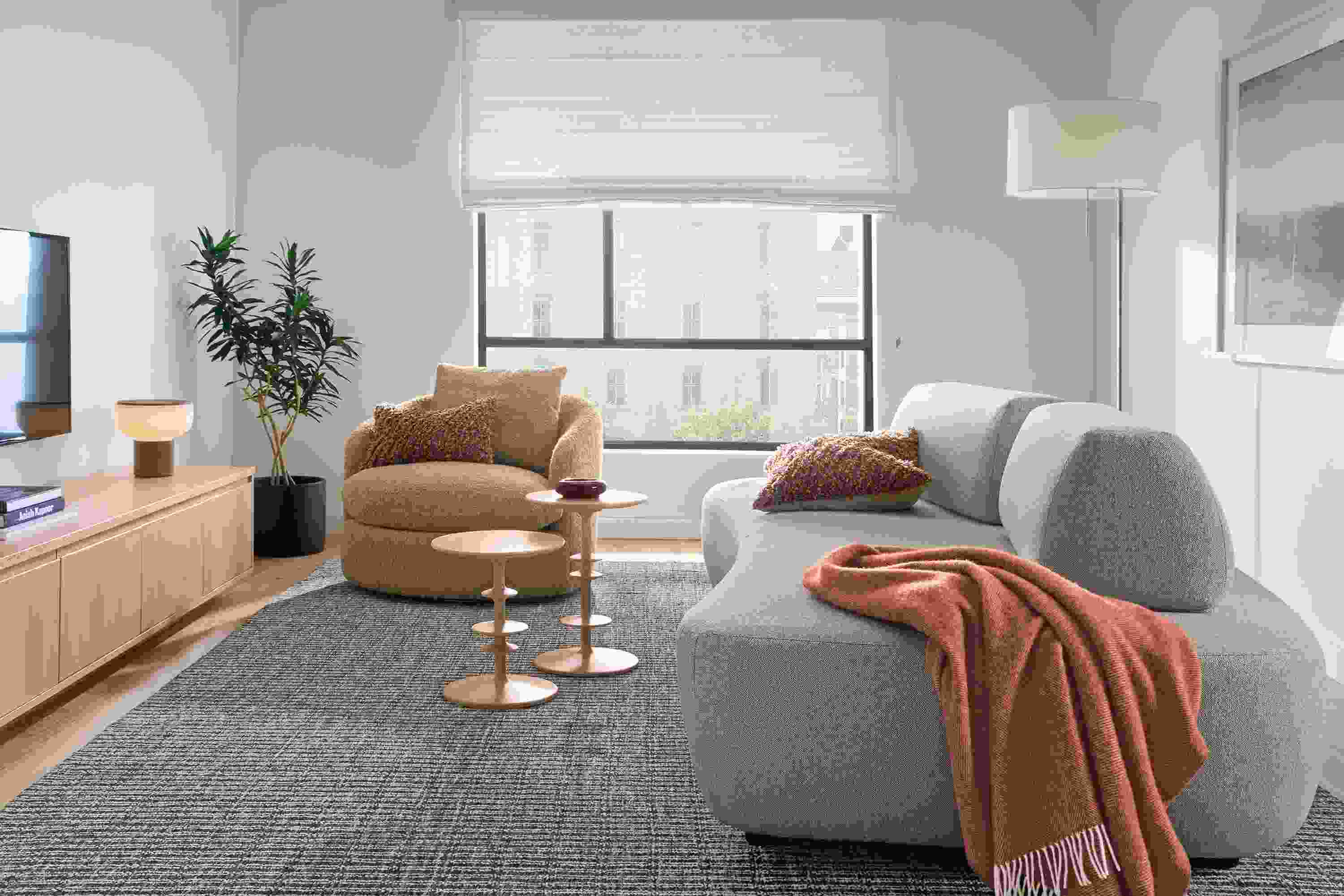 Living room with Muse 101-wide daybed in Tatum Bone, Suri swivel chair in Dornick Camel and 2 parks end tables in salt on red oak.