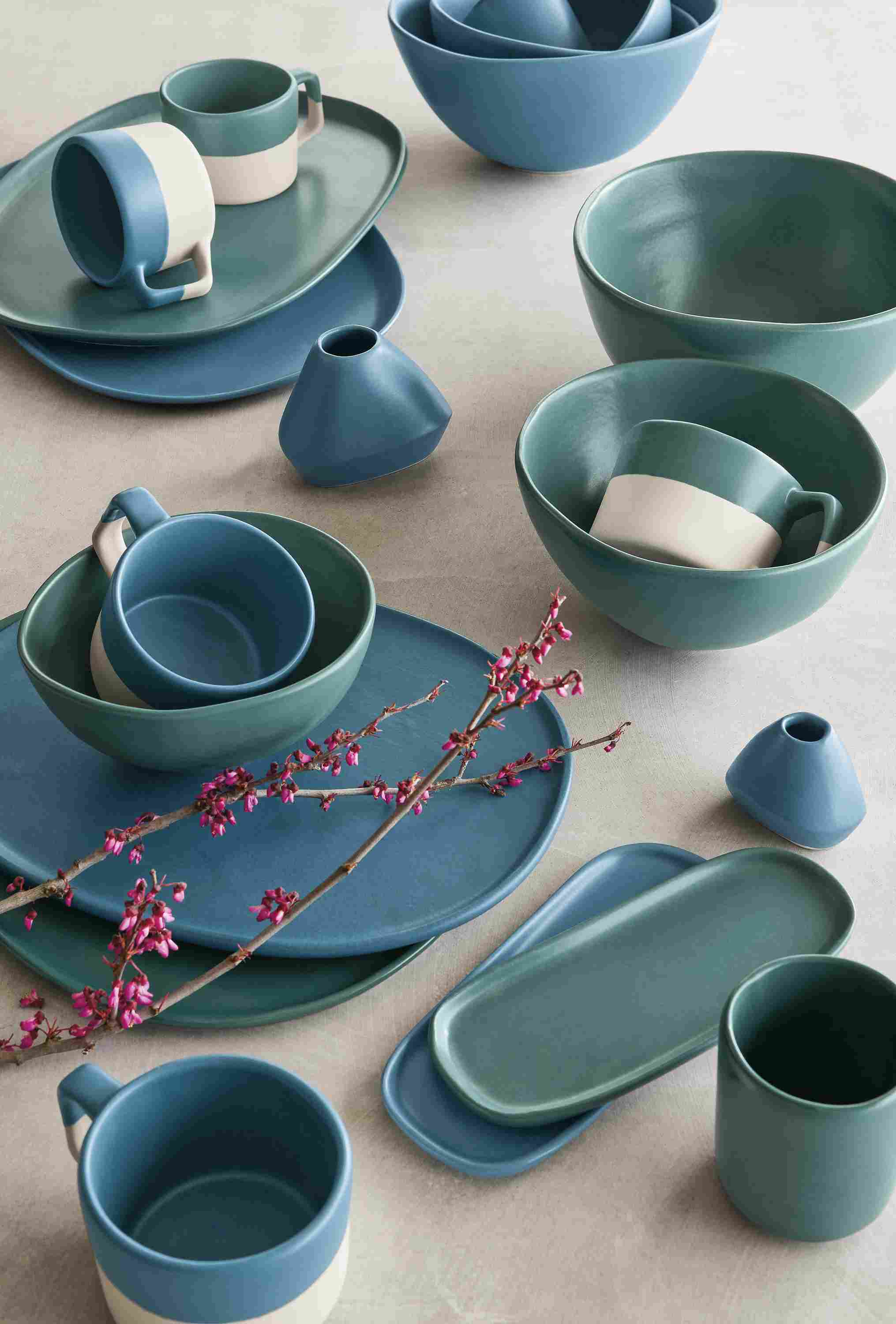 Detail of Nadia mugs, bowls, trays, bud vases in white, denim, teal.