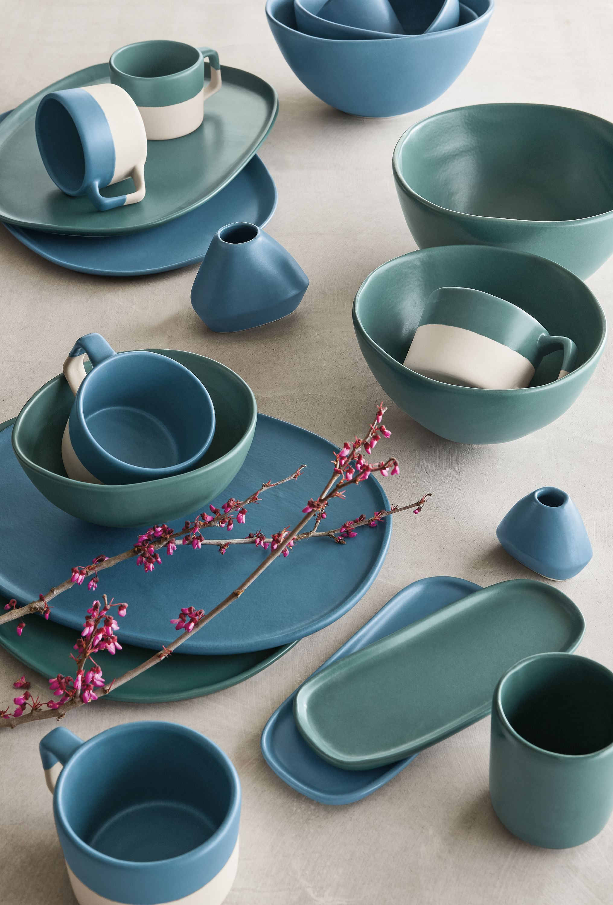 Detail of Nadia mugs, bowls, trays, bud vases in white, denim, teal.