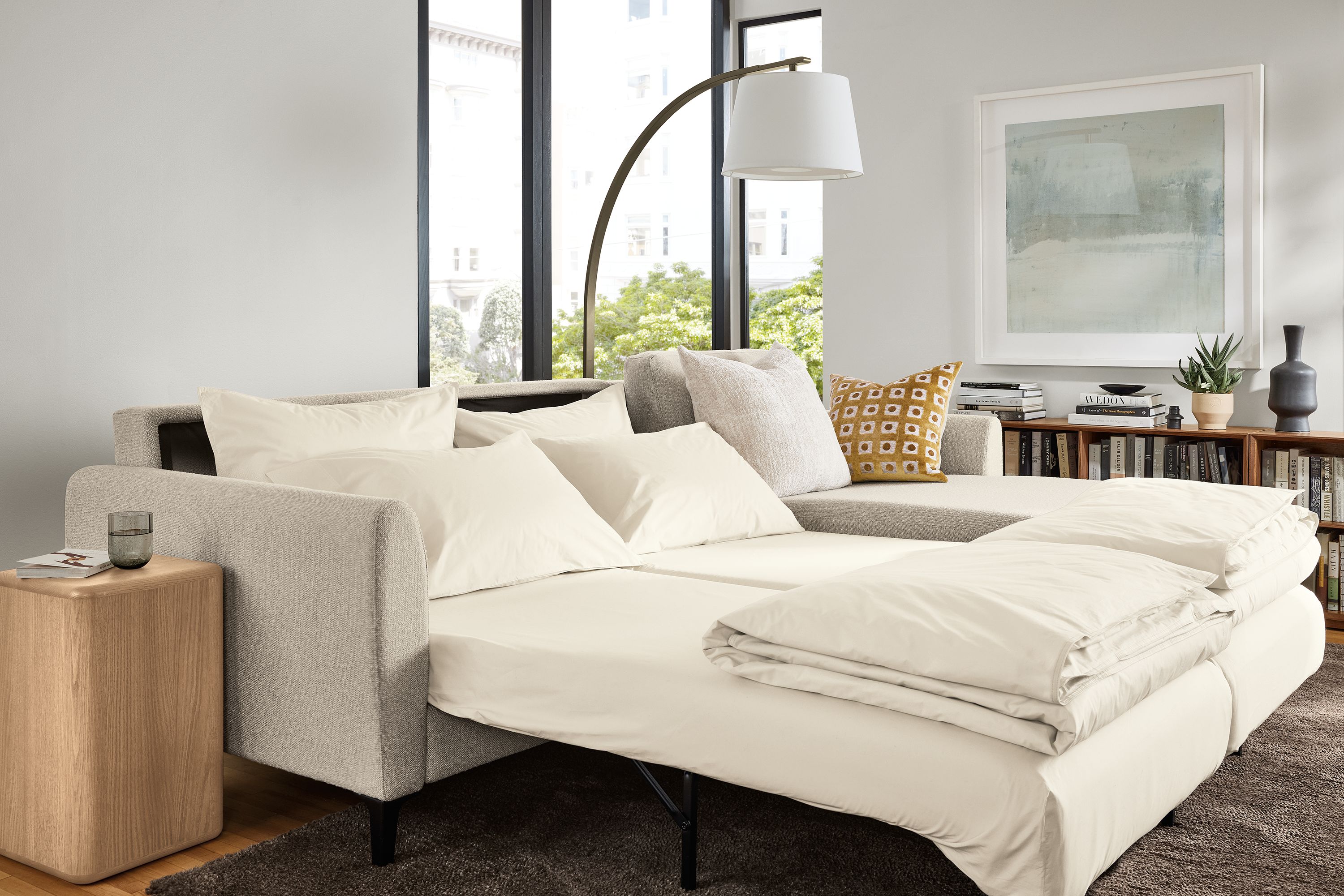 Living room with Natalia queen sleeper sofa in conley natural shown with both beds extended.