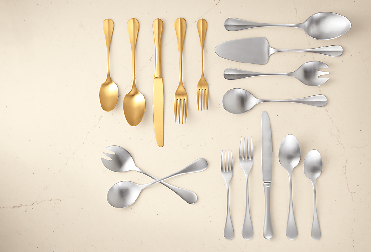 detail of nau flatware in silver and gold and antigo flatware in silver and gold.
