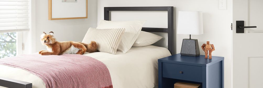 https://rnb.scene7.com/is/image/roomandboard/navPromo_bedroom_03_0523?size=2400,2400&scl=1