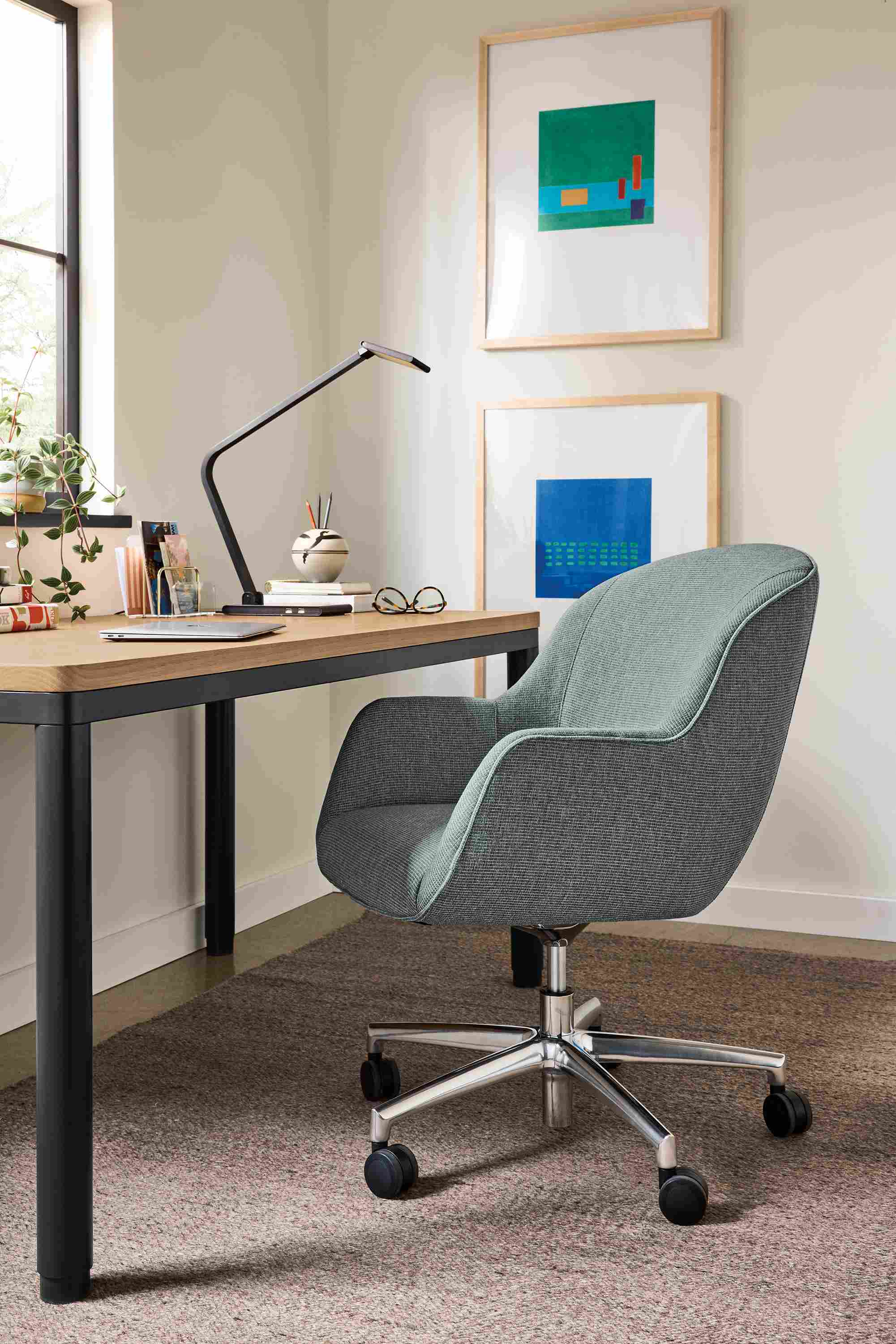 Office area with Nico office chair in Kesler Slate and Ames adjustable standing desk in graphite and rye on red oak.