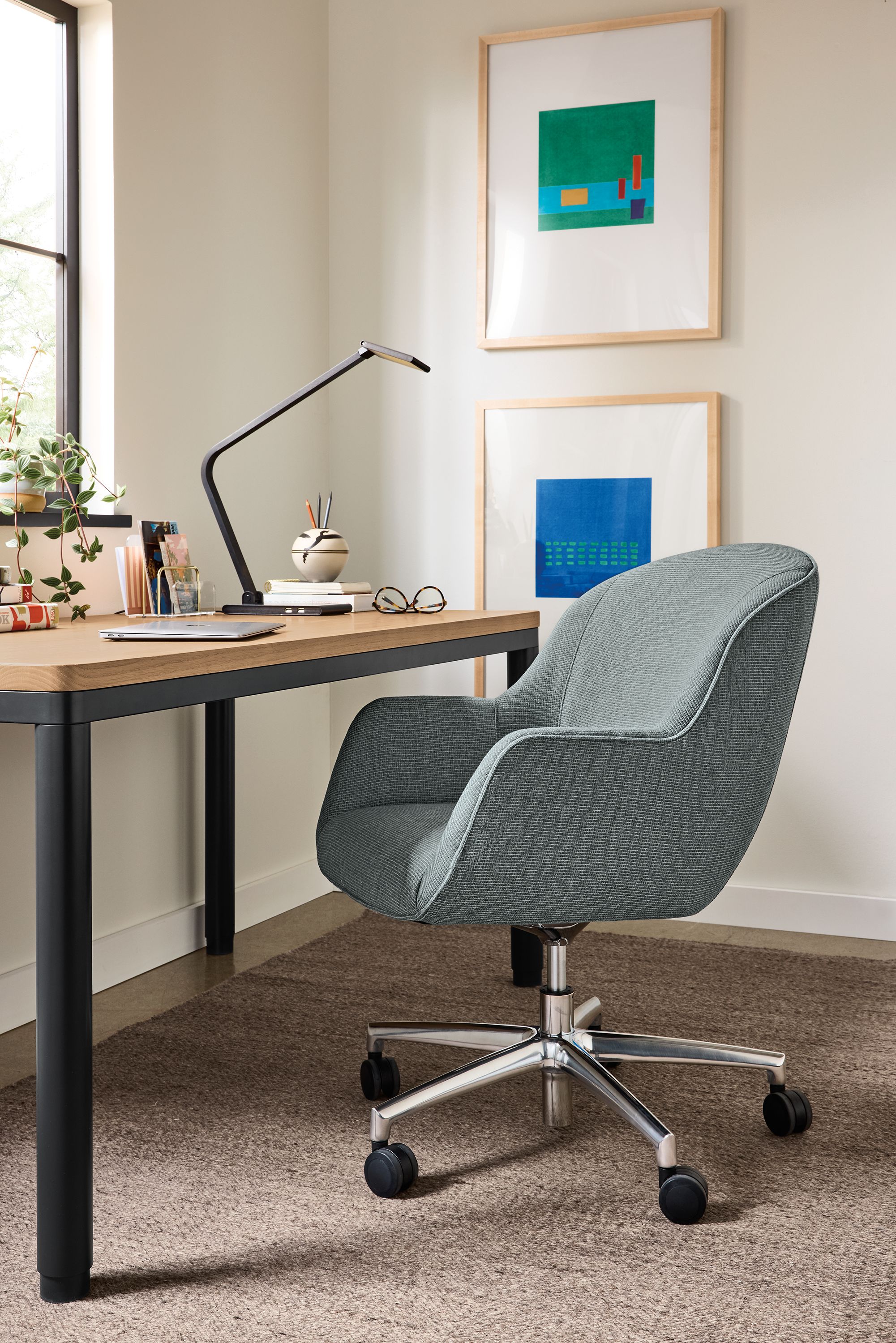 Office area with Nico office chair in Kesler Slate and Ames adjustable standing desk in graphite and rye on red oak.