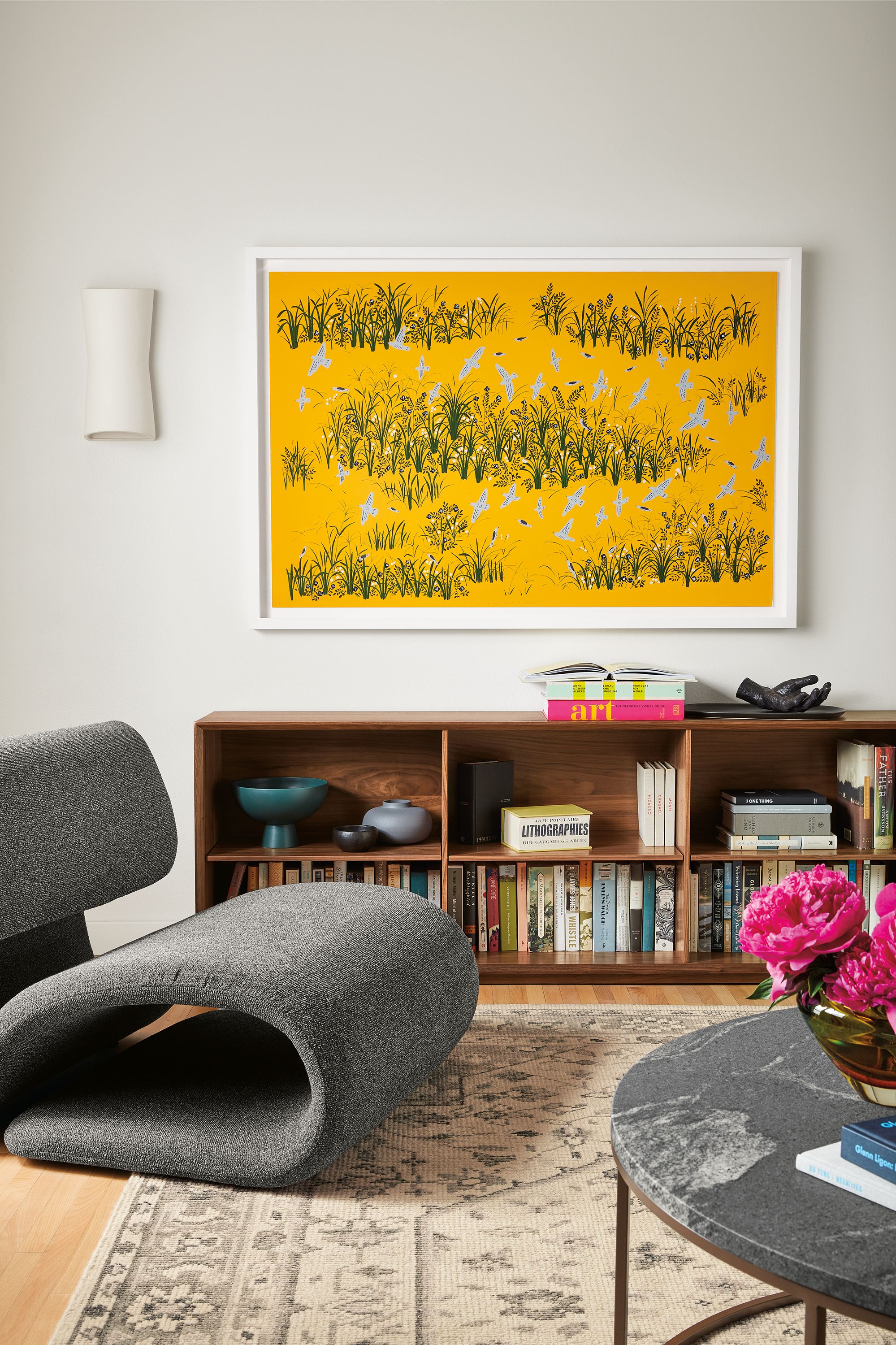 Room setting with Eve Lounge Chair and Rollins stacking cube with base in Walnut.