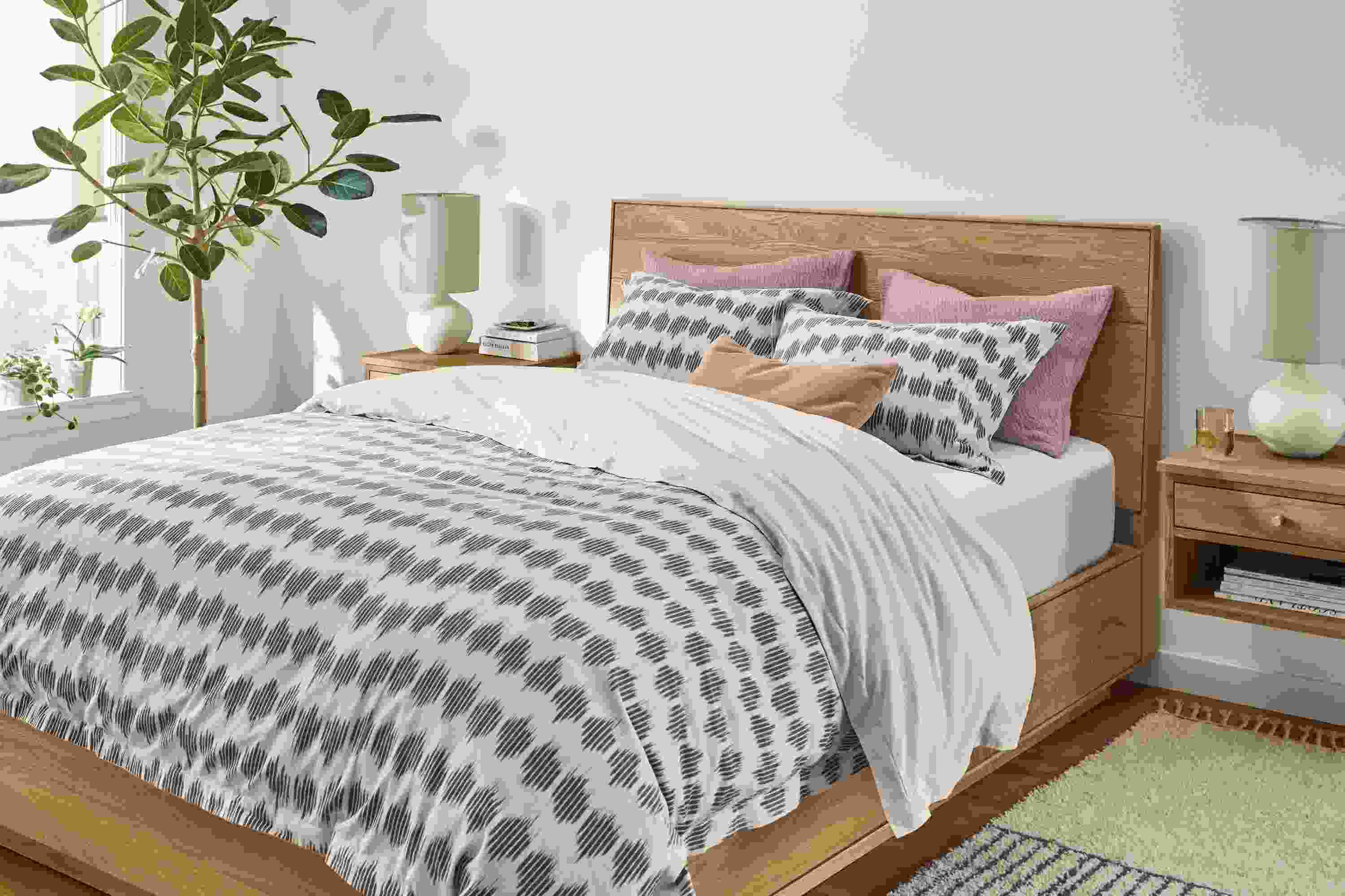 Bedroom setting with Nija Duvet set in Black and Natural on Hudson Storage Bed in White Oak.