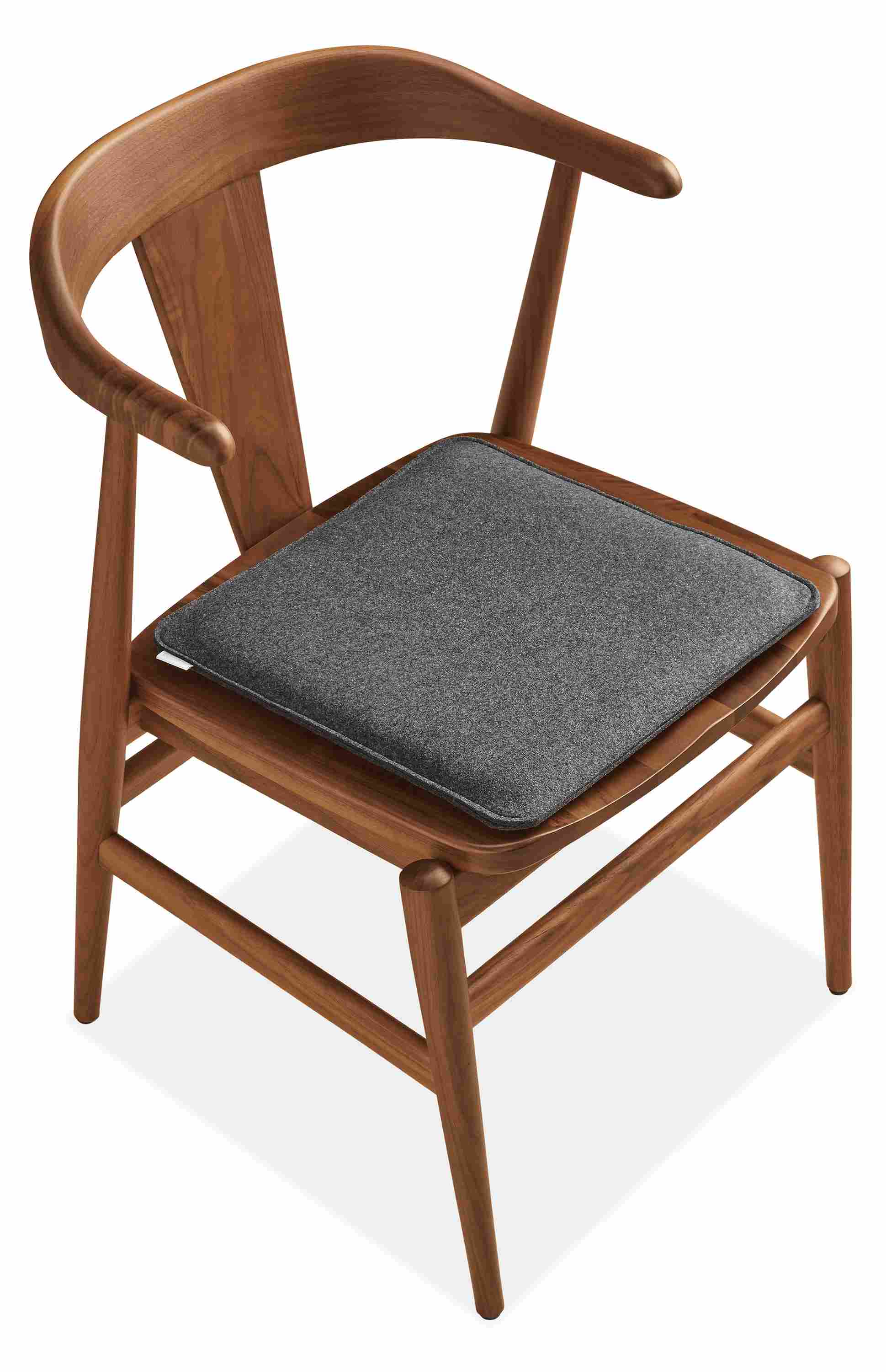 Detail of Nina 15-Square Seat Cushion in Felt Charcoal on Evan Arm Chai.