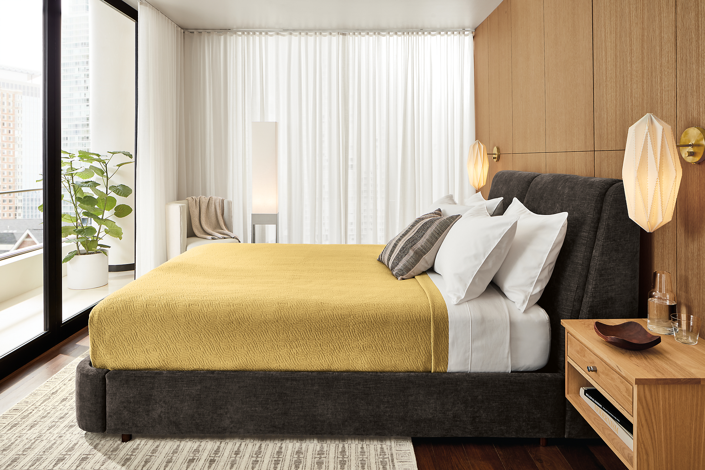 Bedroom with Nora storage bed in mori charcoal fabric with yellow blanket.