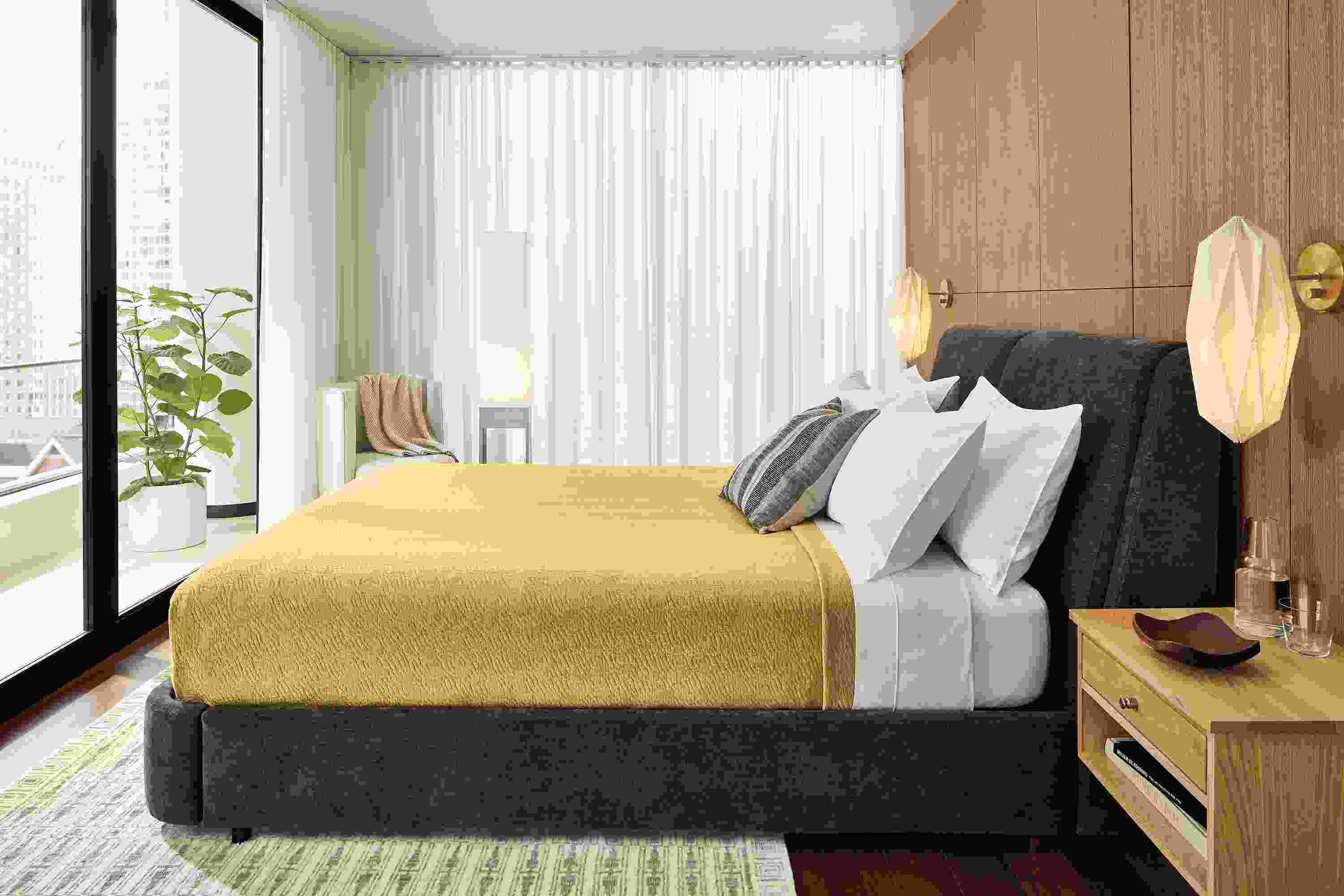 Bedroom with Nora storage bed in mori charcoal fabric with yellow blanket.