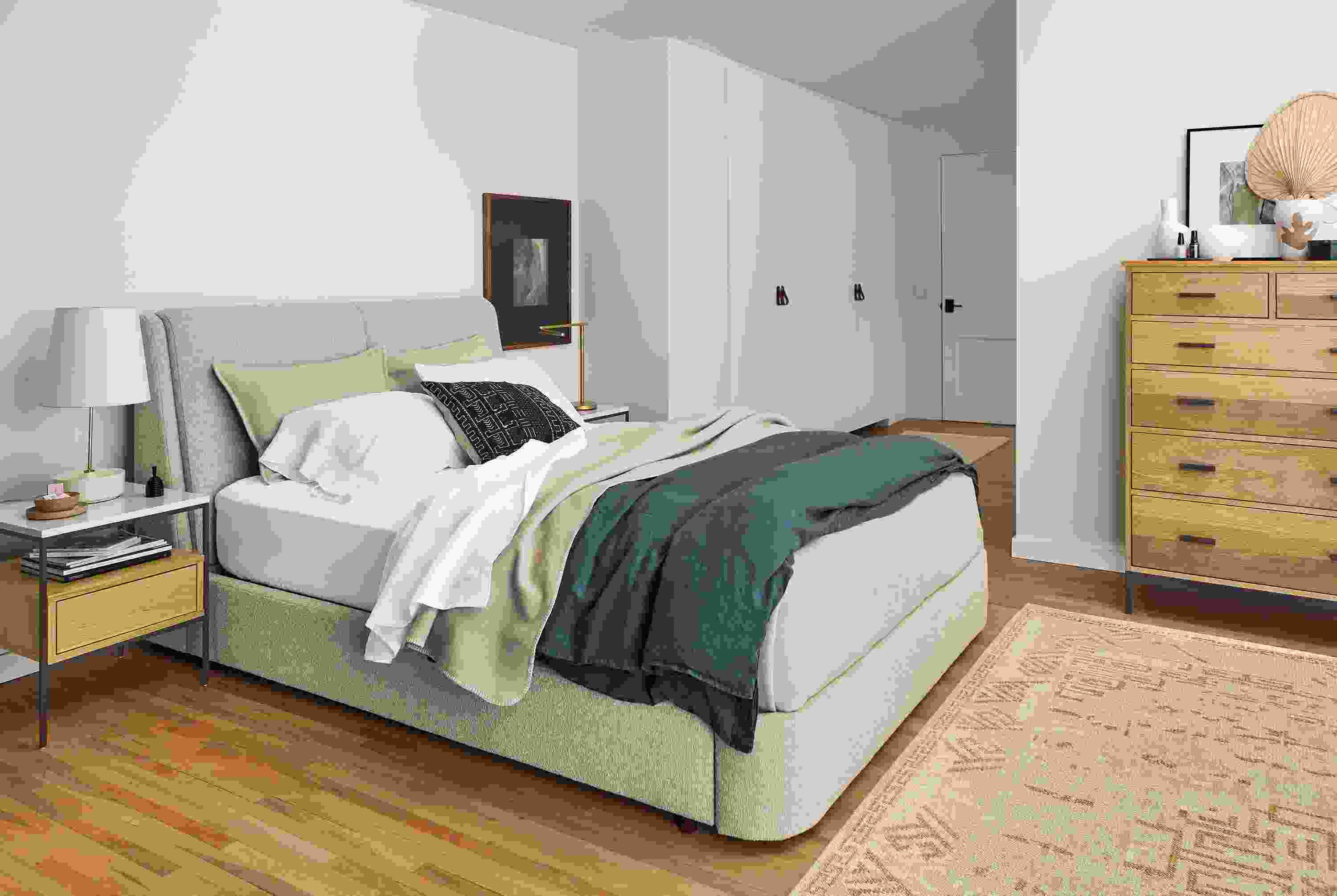 bedroom with nora queen storge bed in conley natural fabric.