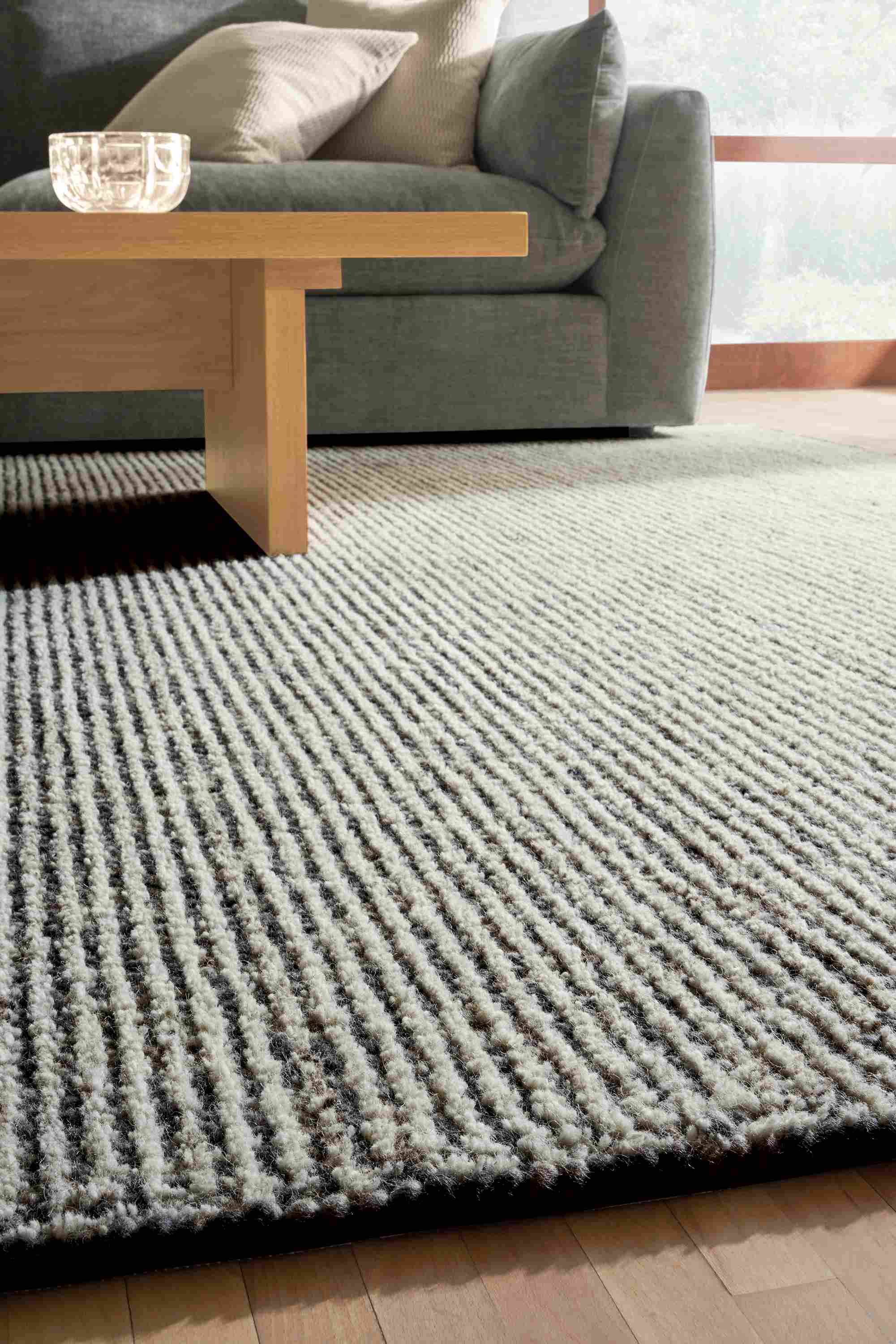 detail of norfolk rug in smoke in living room.