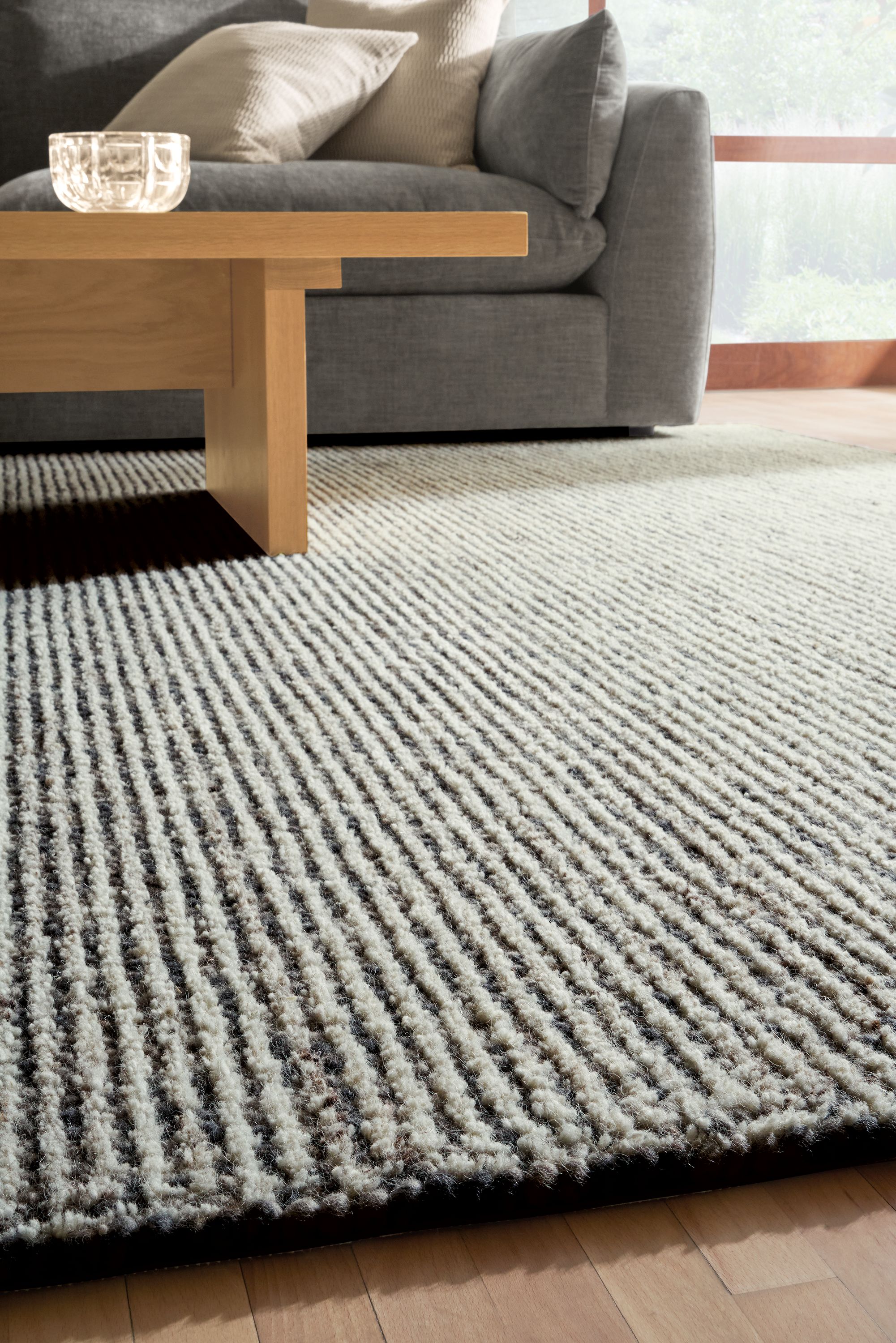 detail of norfolk rug in smoke in living room.