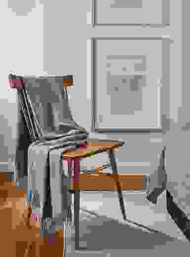 detail of thatcher chair in walnut with Norton throw blanket.
