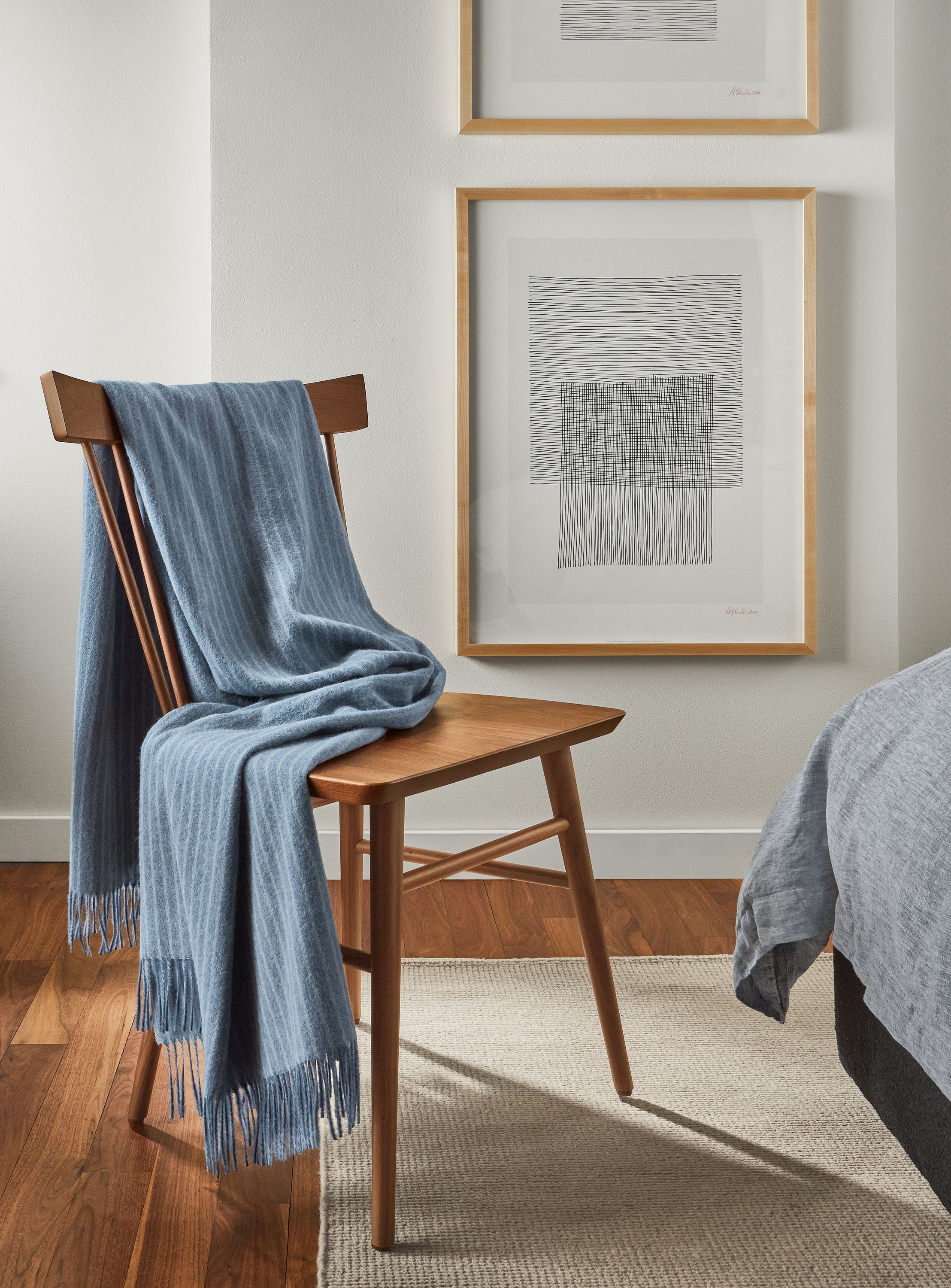 detail of thatcher chair in walnut with Norton throw blanket.