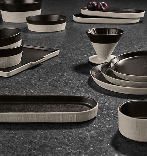 tabletop with notos dishware in black stacked.