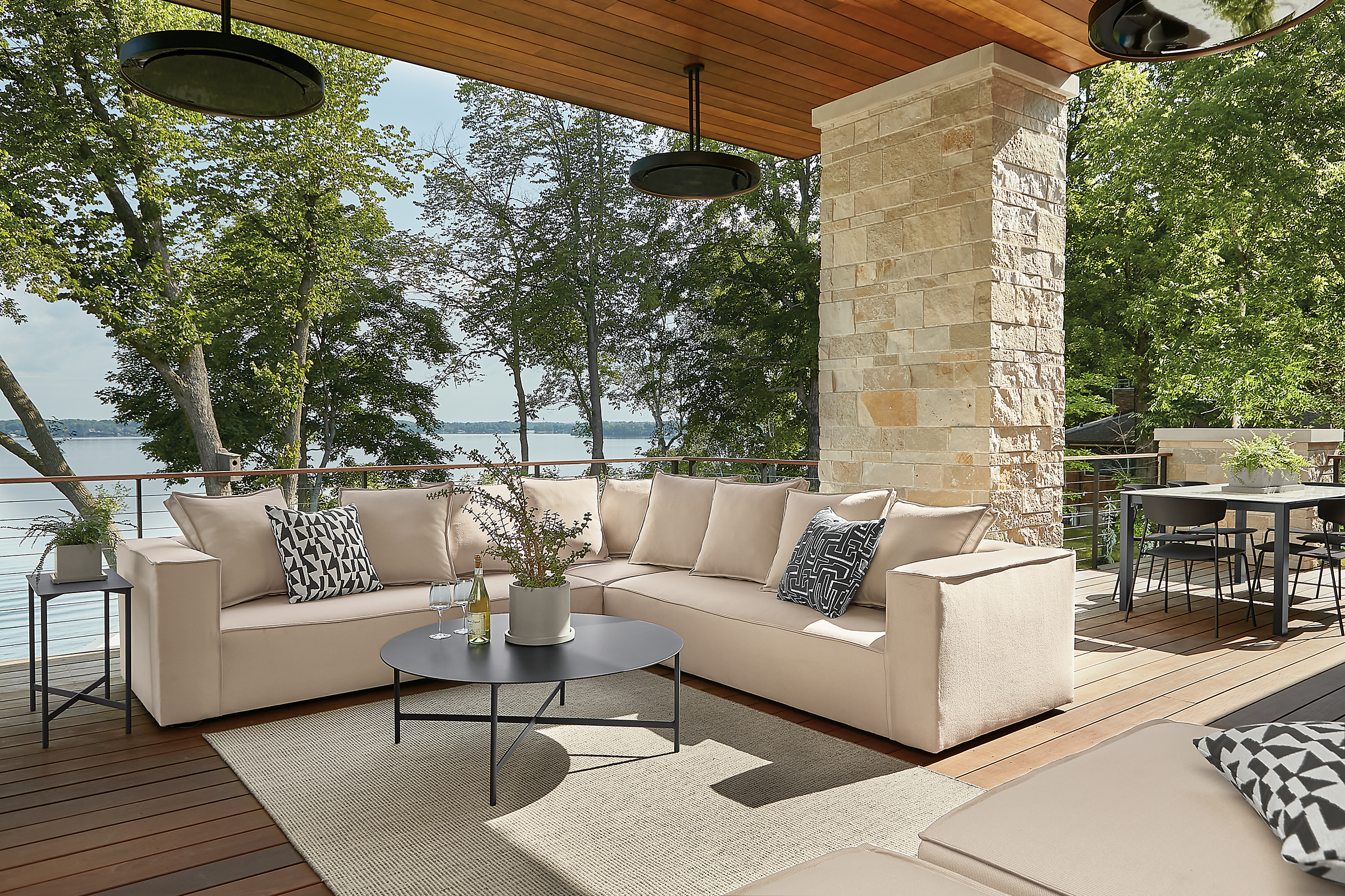 Outdoor space with large oasis sectional, circuit coffee table and selby rug.