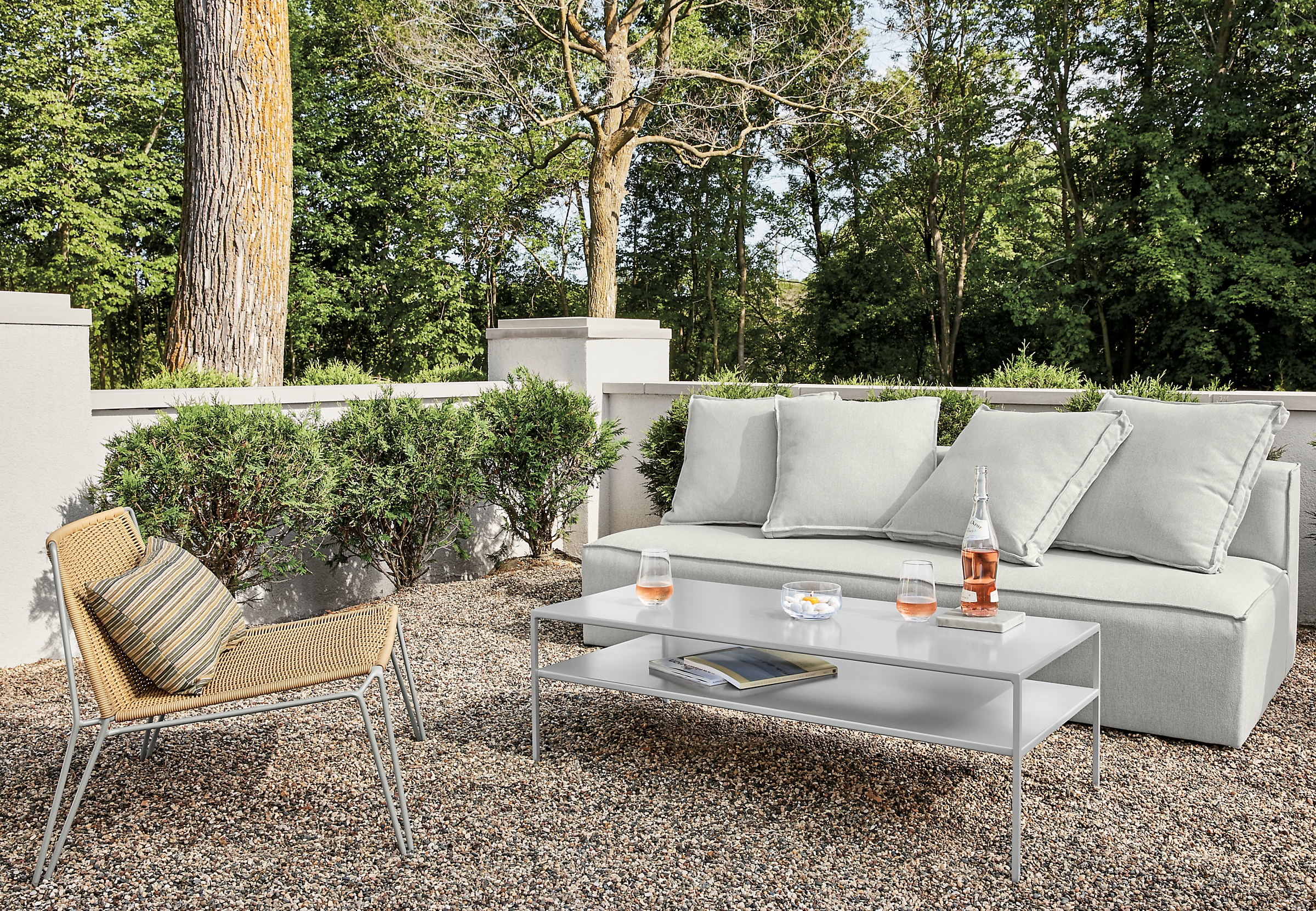 Detail of Oasis outdoor sofa in Mist grey fabric with Slim outdoor coffee table.