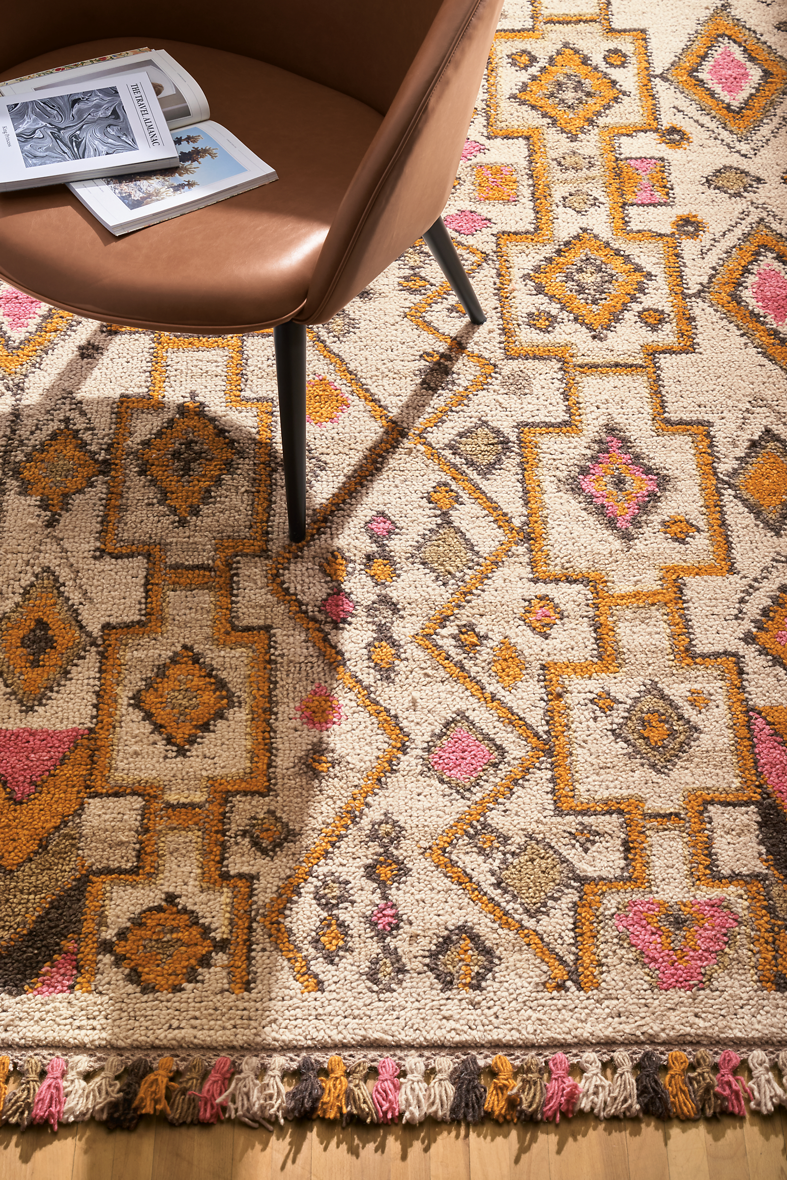 Close-up of a Sylvan Lounge Chair on a Ona Rug in Desert.