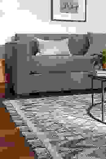 Detail of Ona rug in Ocean color in living room.