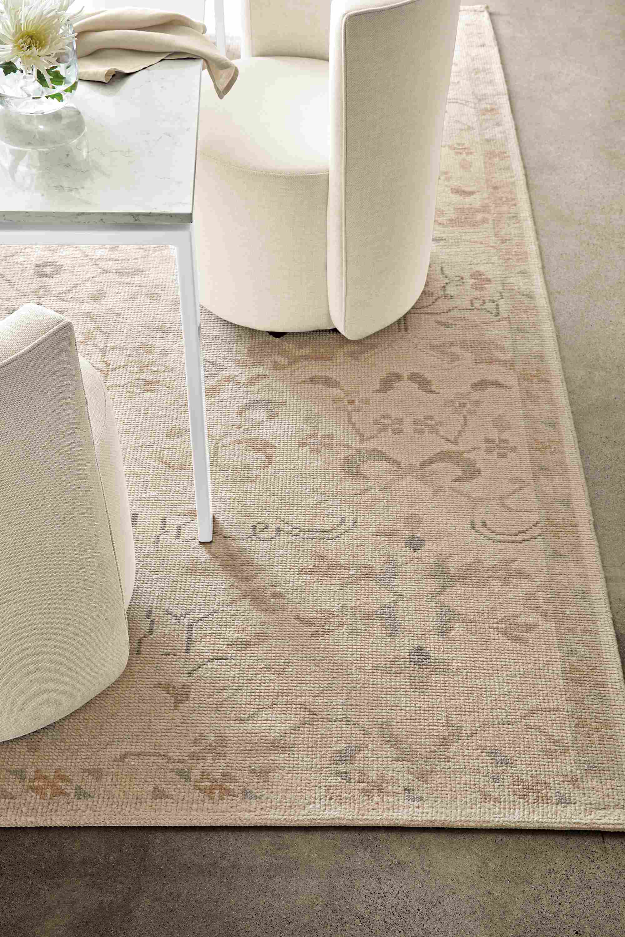 Dining room setting with Ophelia Rug in Pumice and Rand 72-wide Table in white with marbled white quartz top.