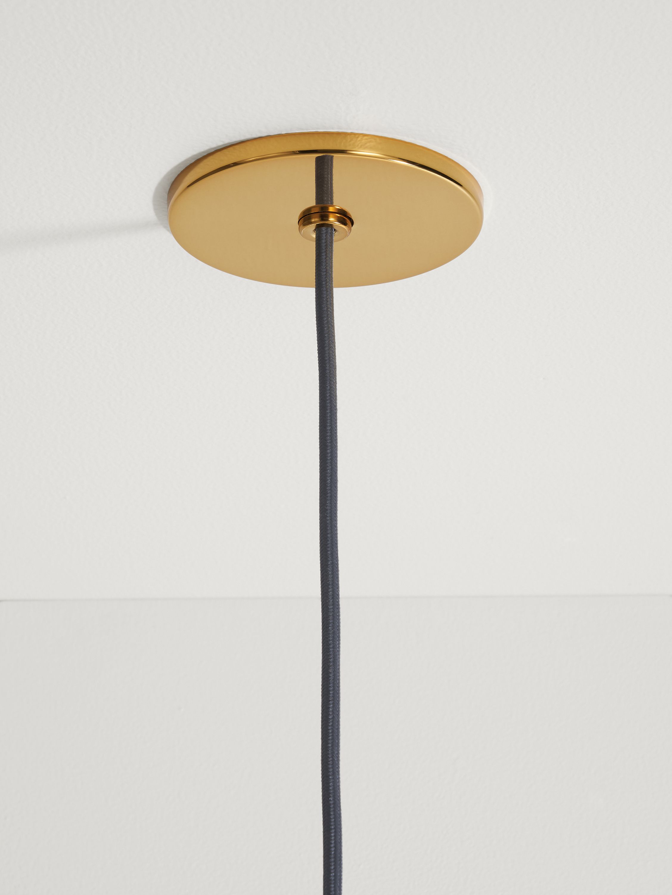 Detail of Orbit 12-Round Pendant in Brass and White Glass.