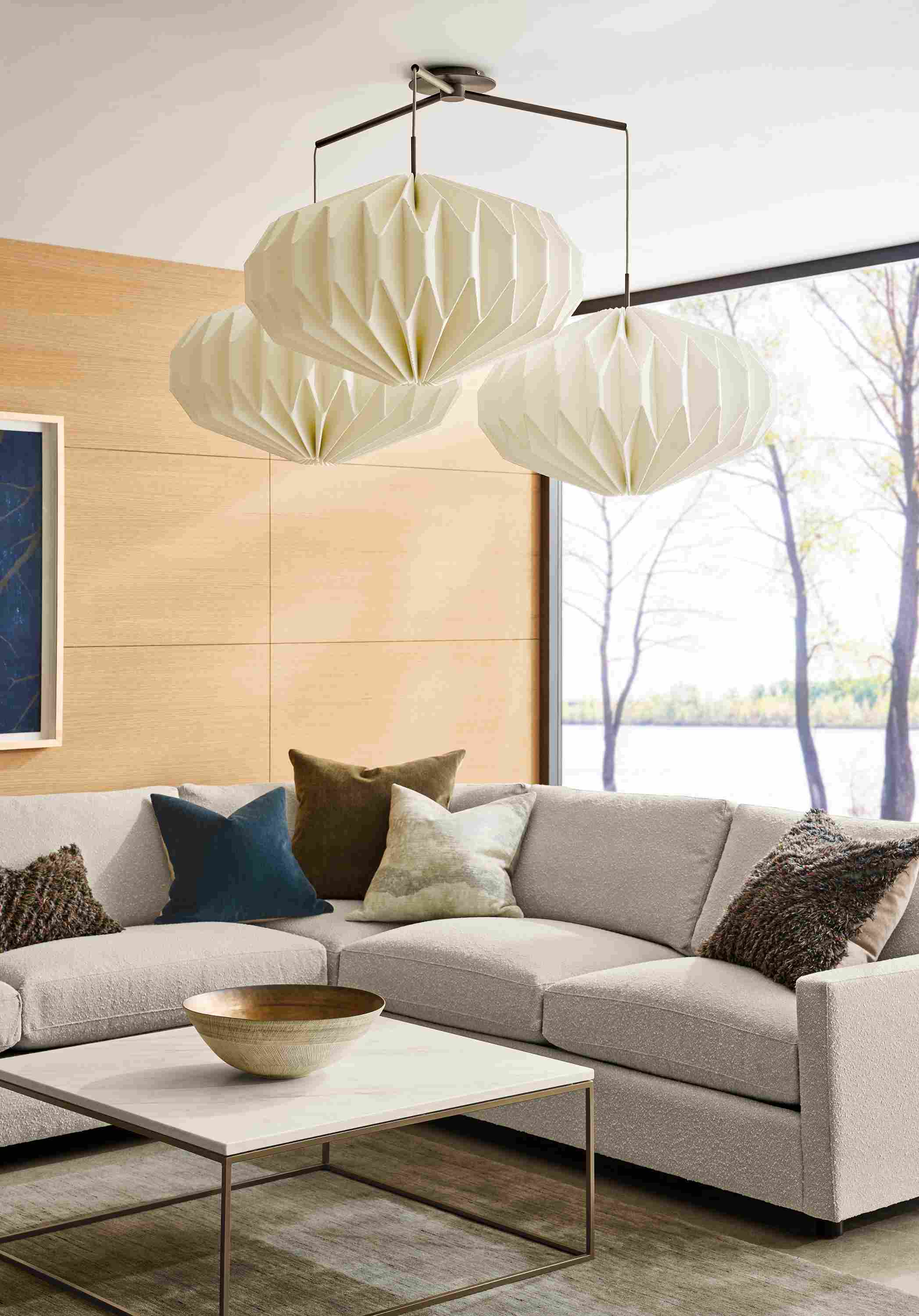 Living room with Orikata set of 3 pendant lights with 24-inch saucers in ivory with oil rubbed bronze graphite hardware.