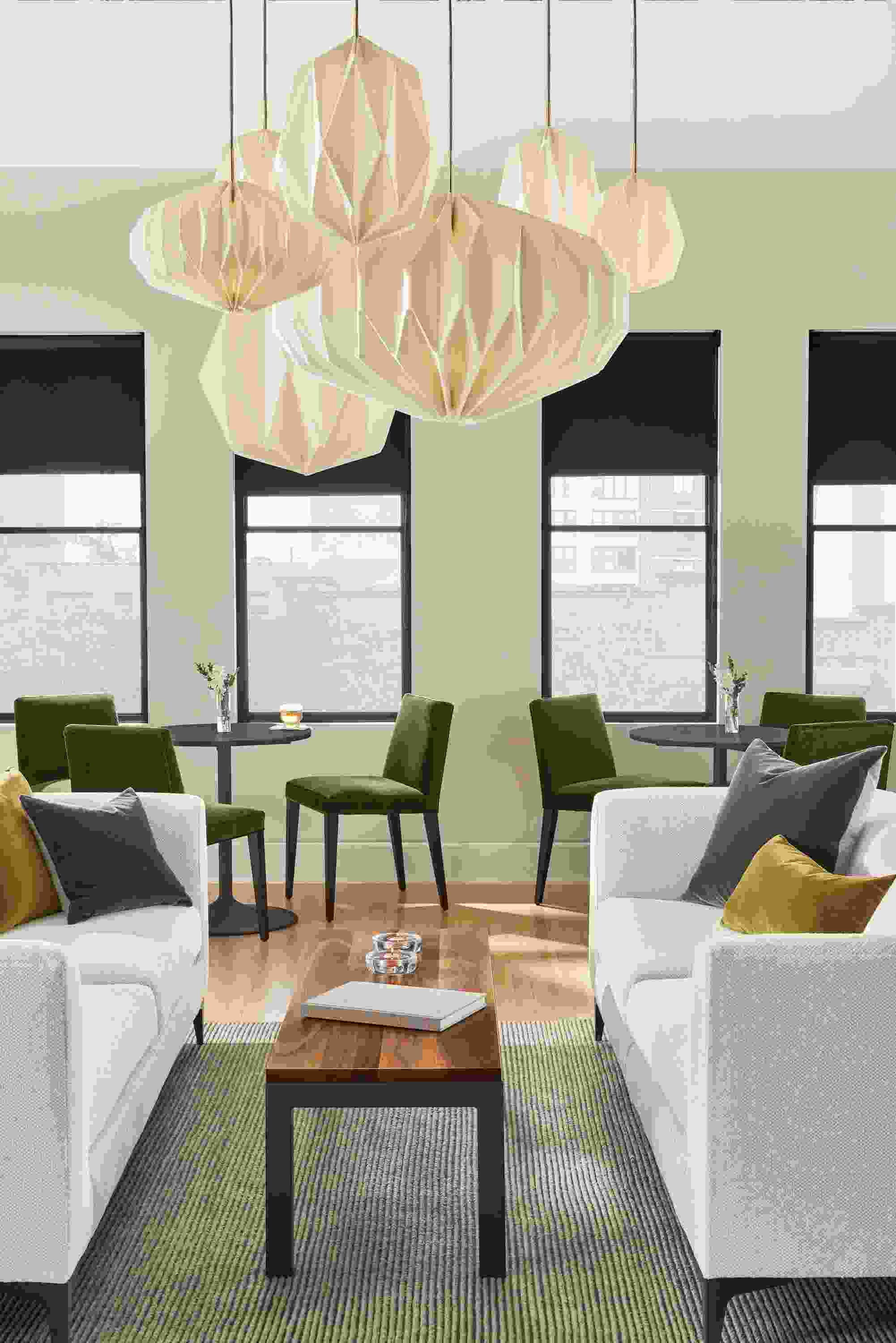 Room setting with an Orlin Coffee Table with York Sofa in Sumner Linen and a Boden Chair in Urbino Leather.