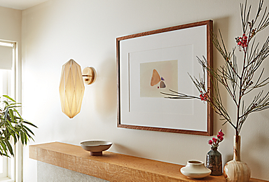 Living room with Orikata wall sconce in ivory linen.